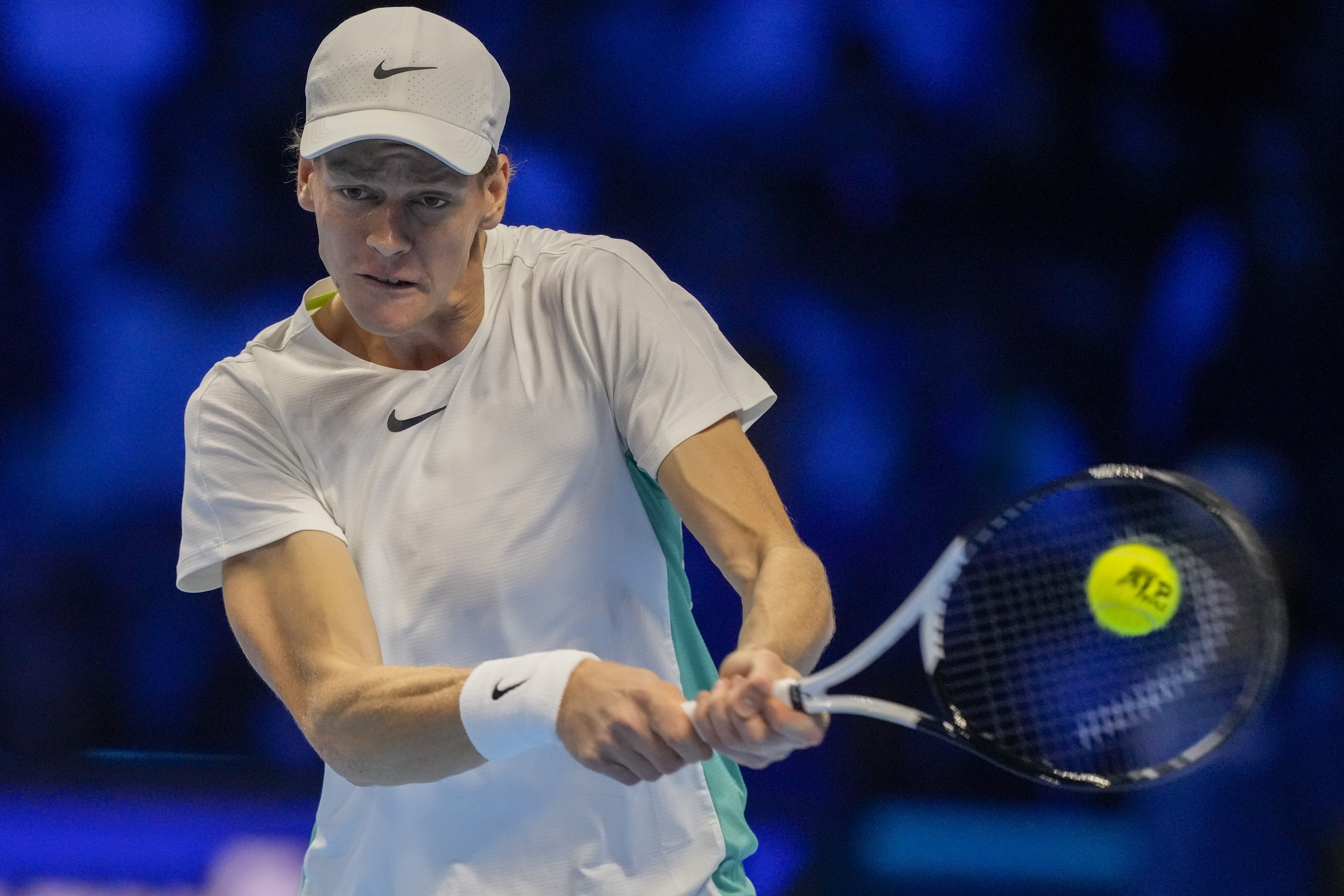 Italy's Jannik Sinner returns the ball to Serbia's Novak Djokovic during their singles final tennis match of the ATP World Tour Finals at the Pala Alpitour, in Turin, Italy, Sunday, Nov. 19, 2023. (AP Photo/Antonio Calanni)