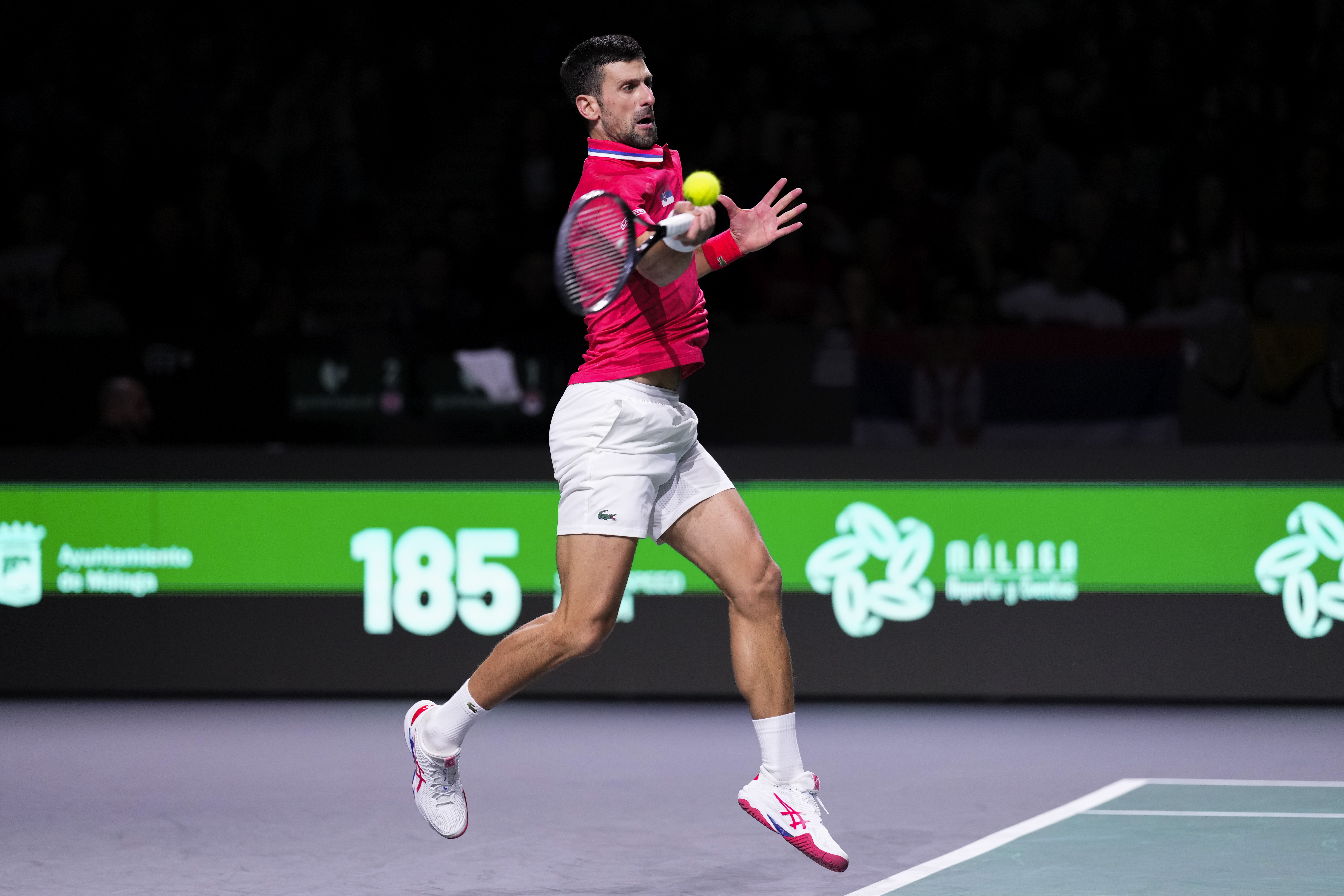 Serbia's Novak Djokovic plays a shot against Britain's Cameron Norrie during a Davis Cup quarter-final tennis match between Serbia and United Kingdom in Malaga, Spain, Thursday, Nov. 23, 2023. (AP Photo/Manu Fernandez)