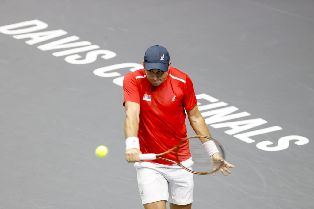 epa10856137 Serbia's Dusan Lajovic in action against South Korea's Seongchan Hong during the 2023 Davis Cup Finals C Group tennis match between Serbia and South Korea, in Valencia, eastern Spain, 12 September 2023.  EPA-EFE/Kai Foesterling