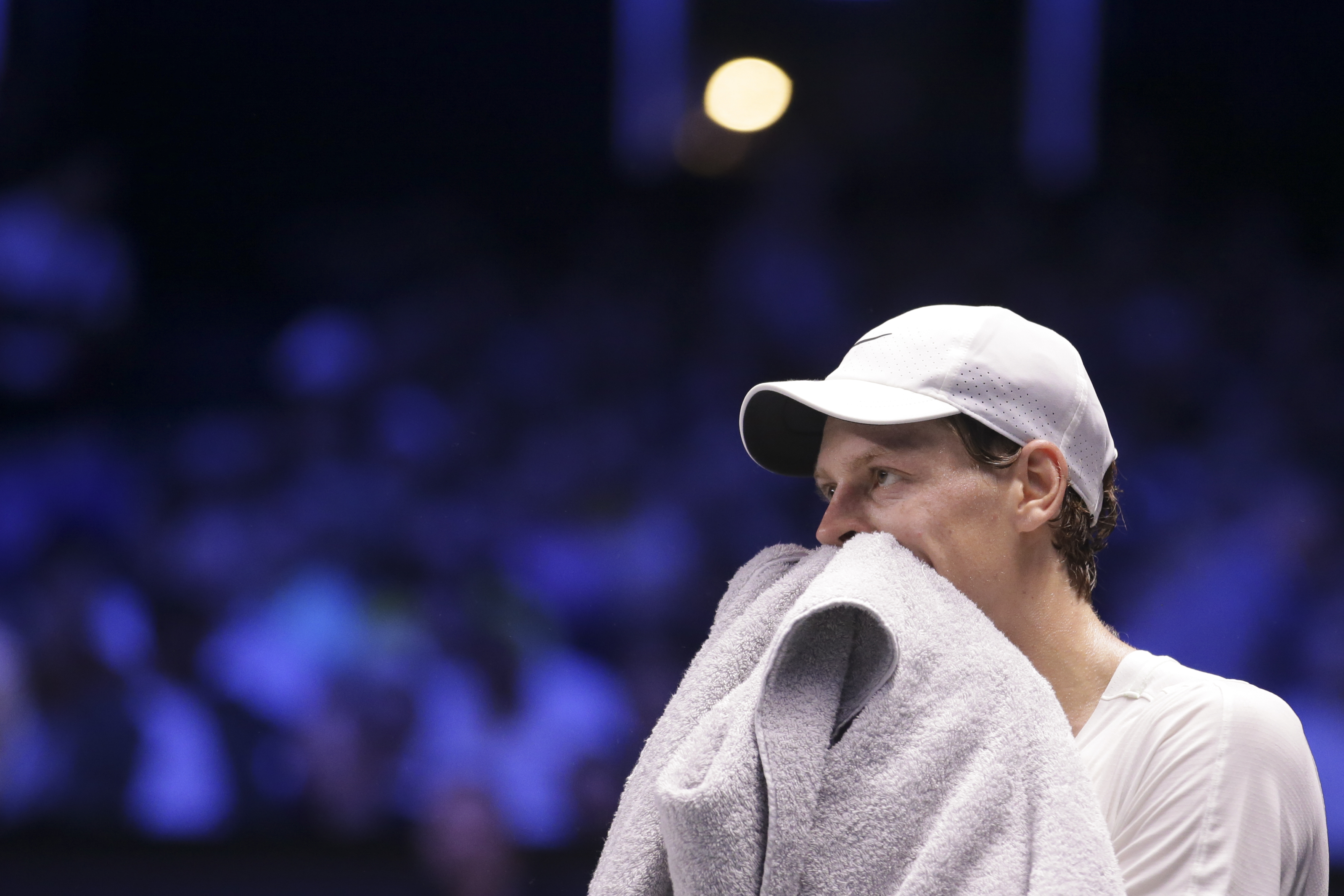 Jannik Sinner of Italy wipes off sweat during a final match against Daniil Medvedev of Russia at the Erste Bank Open ATP tennis tournament in Vienna, Austria, Sunday, Oct. 29, 2023. (AP Photo/Heinz-Peter Bader)