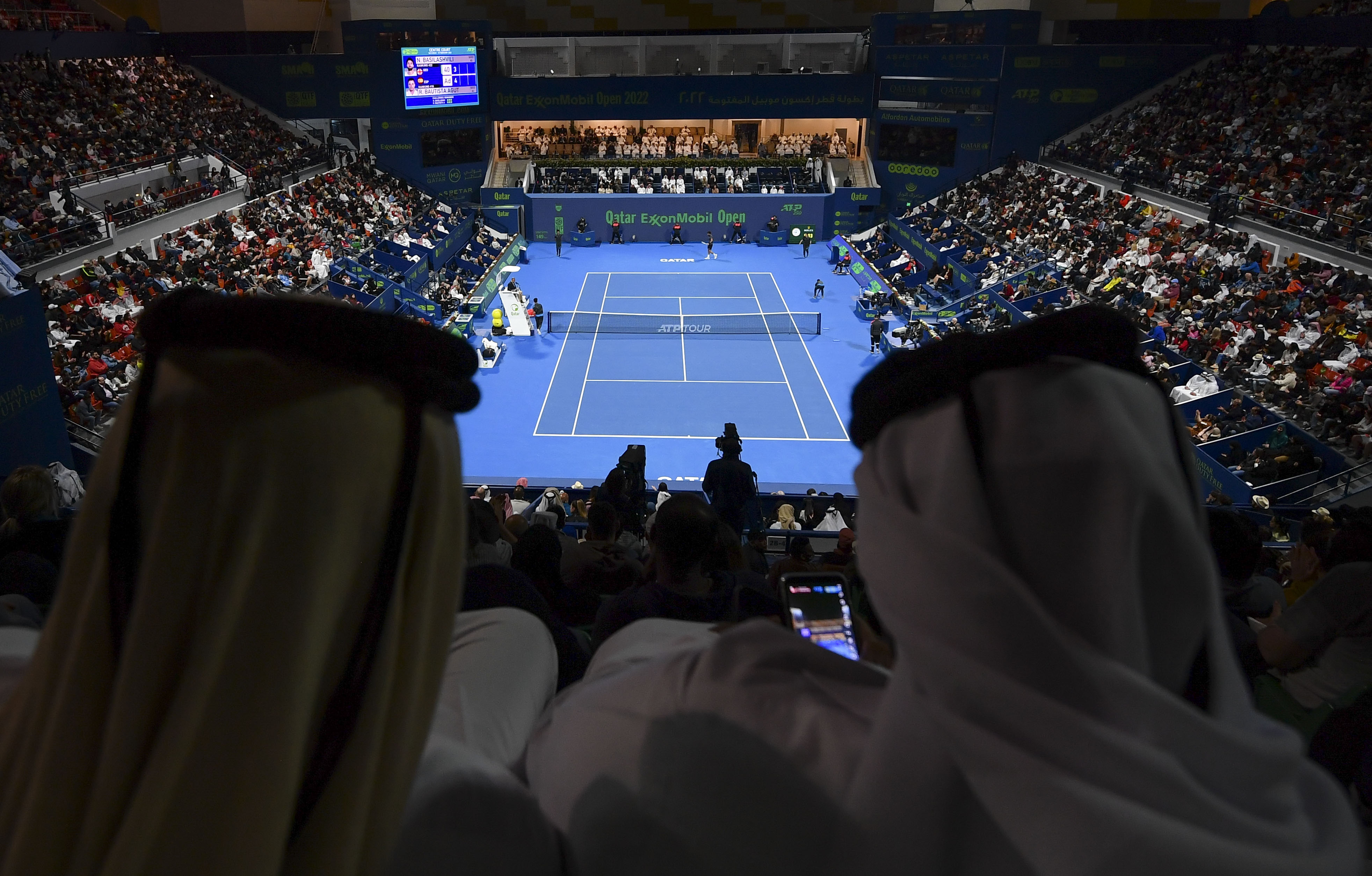 epa09772362 Spectators attend the final match of the ATP Qatar Open Tennis tournament between Roberto Bautista Agut of Spain and Nikoloz Basilashvili of Georgia in Doha, Qatar, 19 February 2022  EPA-EFE/NOUSHAD THEKKAYIL