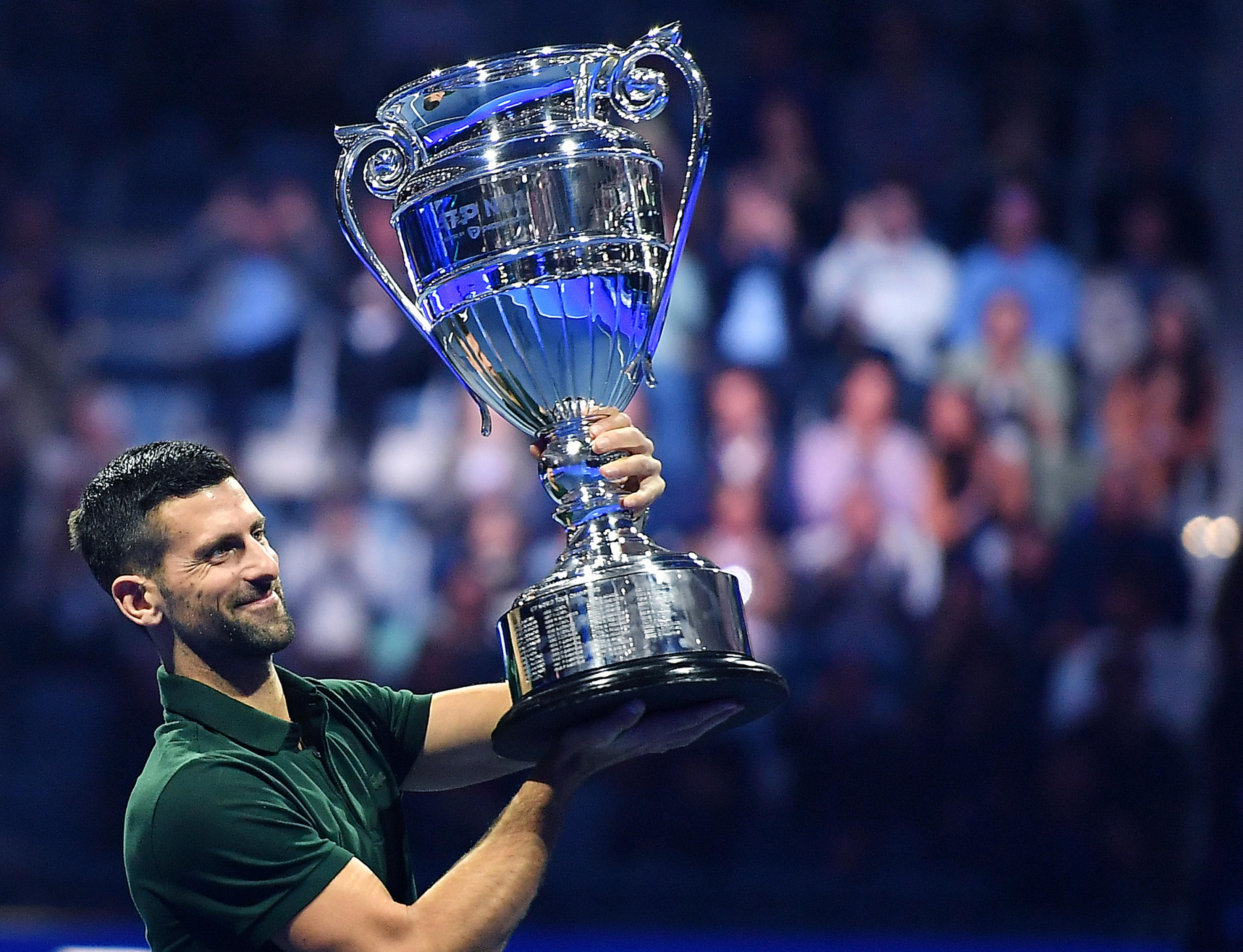 epa10973295 Novak Djokovic of Serbia poses with the trophy awarded for the ATP Year-End Number One in the world ranking, during the Nitto ATP Finals 2023 tennis tournament in Turin, Italy, 13 November 2023.  EPA-EFE/Alessandro Di Marco