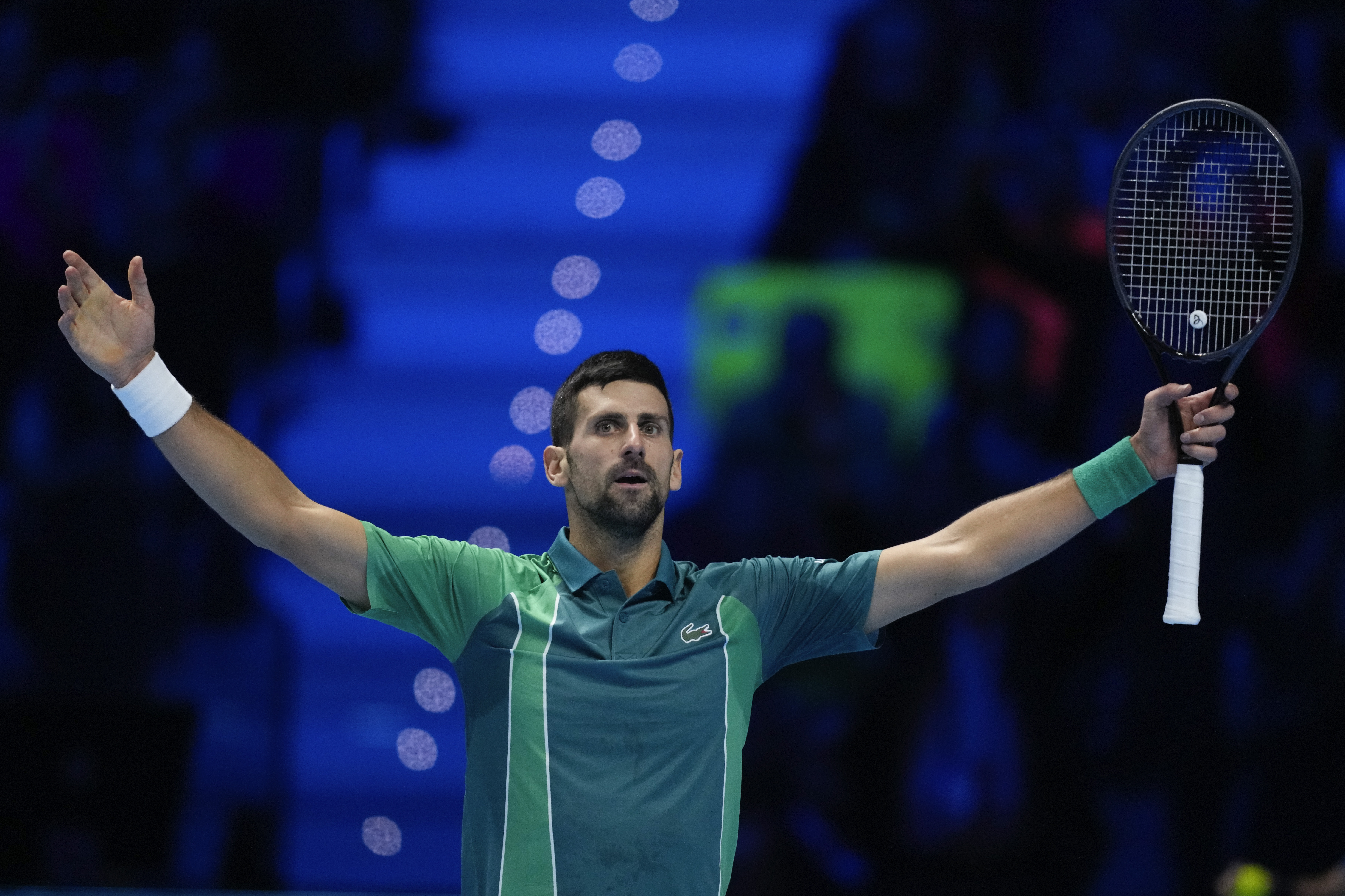 Serbia's Novak Djokovic reacts during his singles semifinal tennis match against Spain's Carlos Alcaraz of the ATP World Tour Finals at the Pala Alpitour, in Turin, Italy, Saturday, Nov. 18, 2023. (AP Photo/Antonio Calanni)