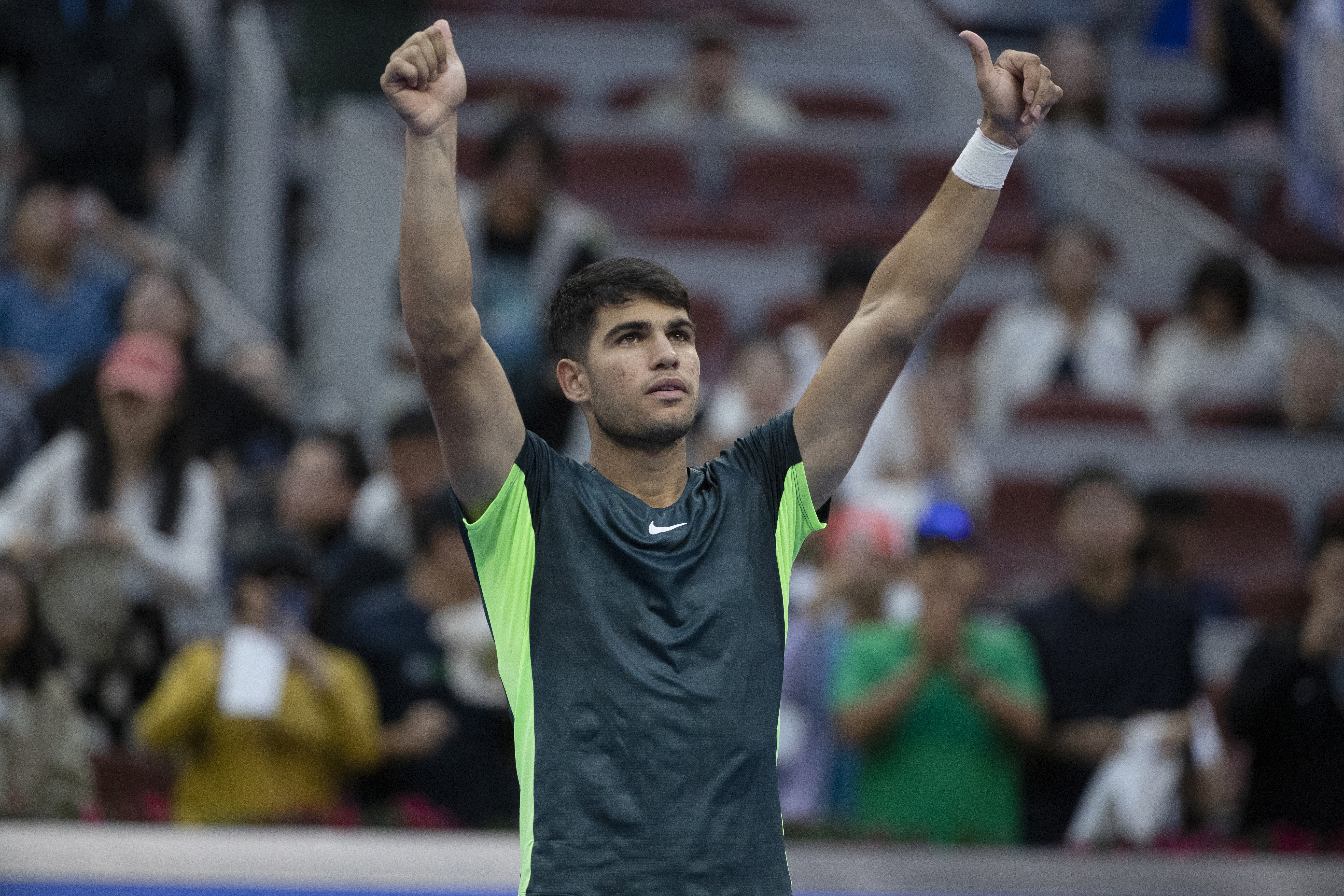 epa10893482 Carlos Alcaraz of Spain celebrates his victory over Lorenzo Musetti of Italy after their second round match at the China Open tennis tournament, in Beijing, China, 01 October 2023.  EPA-EFE/ANDRES MARTINEZ CASARES