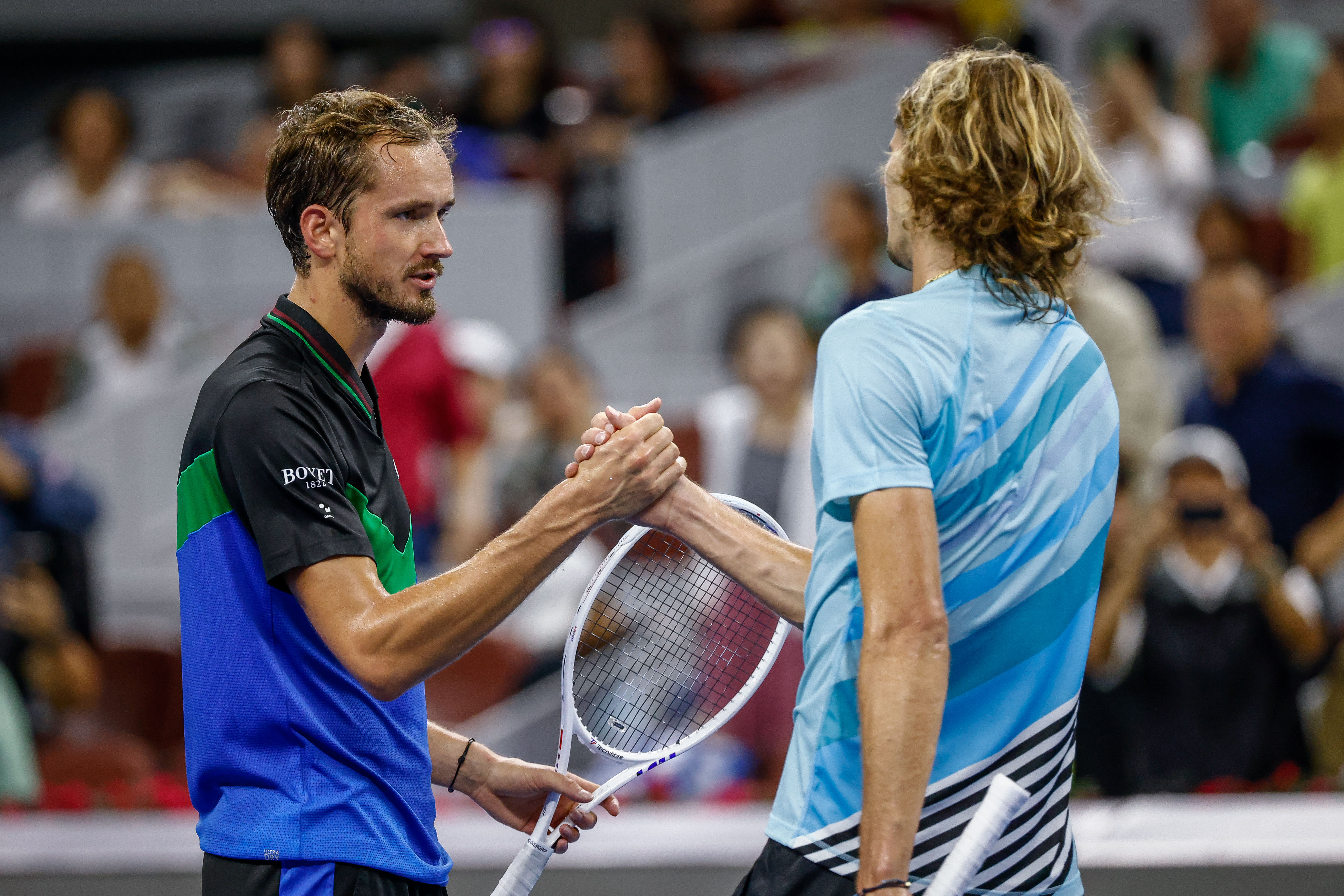 epa10897122 Daniil Medvedev (L) of Russia shakes hands with Alexander Zverev of Germany after their semi-final match in the China Open tennis tournament in Beijing, China, 03 October 2023.  EPA-EFE/MARK R. CRISTINO