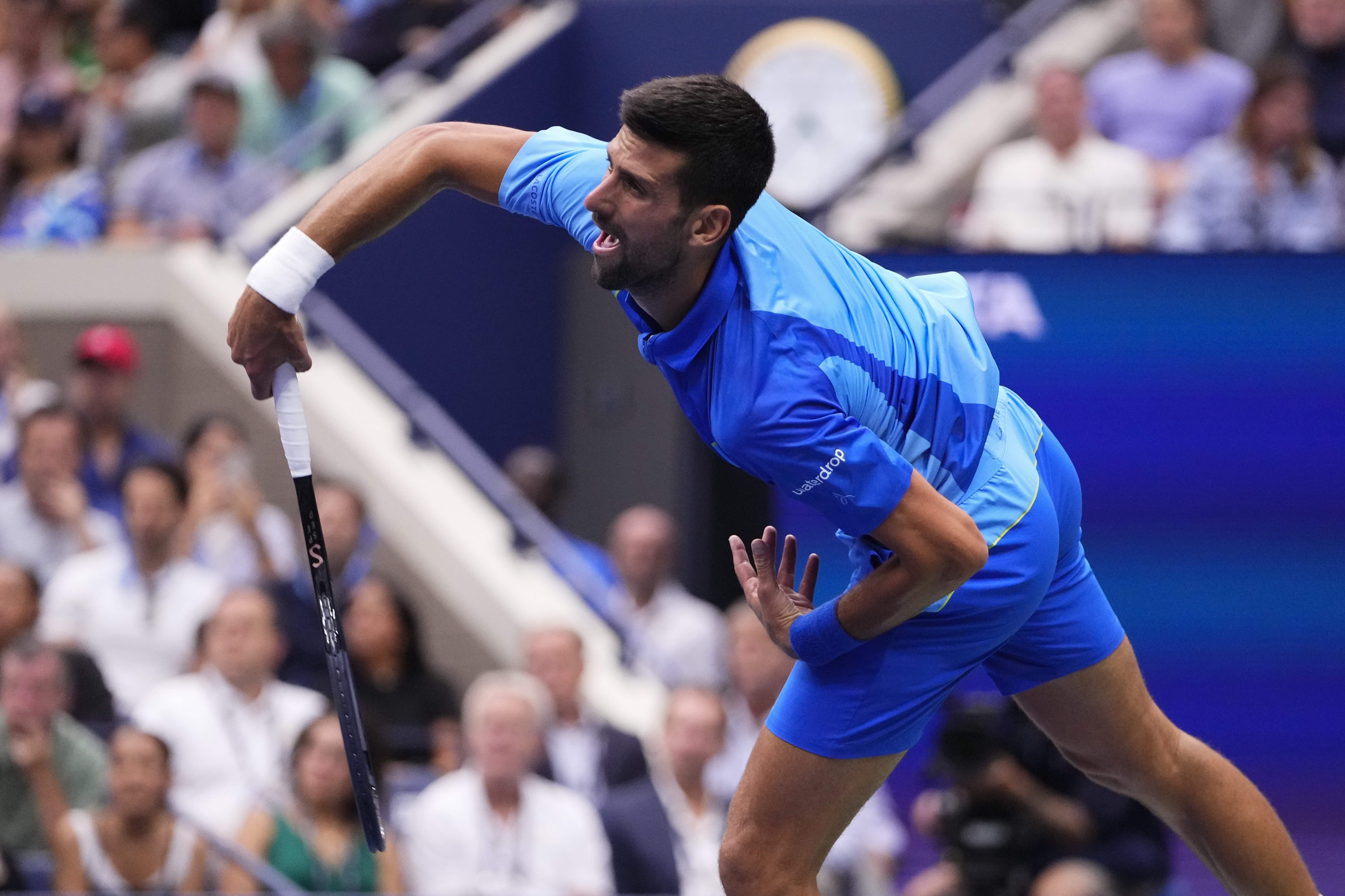 Novak Djokovic, of Serbia, serves to Daniil Medvedev, of Russia, during the men's singles final of the U.S. Open tennis championships, Sunday, Sept. 10, 2023, in New York. (AP Photo/Frank Franklin II)