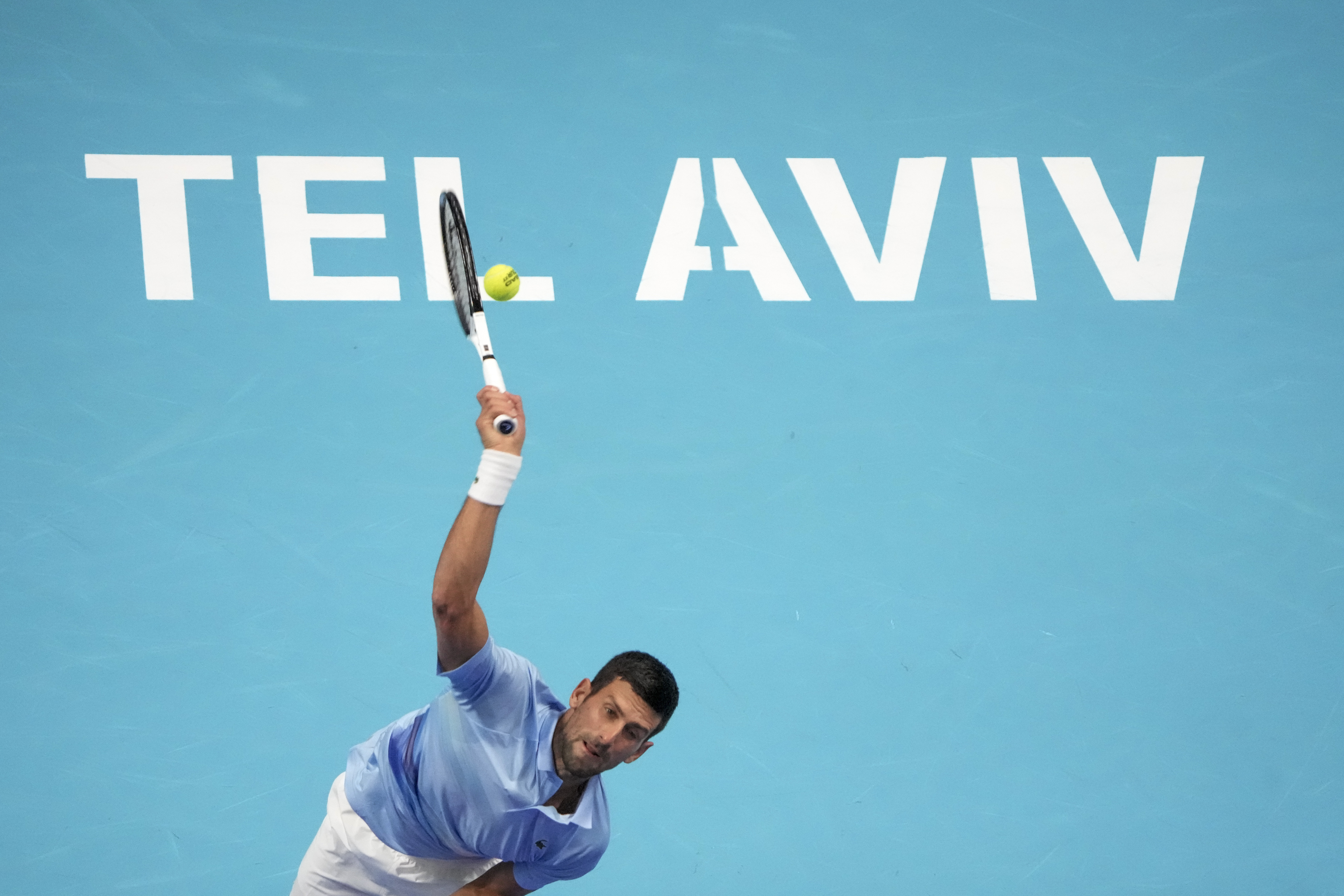 Serbia's Novak Djokovic serves to Spain's Pablo Andujar during the round of 16 at the ATP 250 Tel Aviv open tennis match in Tel Aviv, Israel, Thursday, Sept. 29, 2022. (AP Photo/Ariel Schalit)