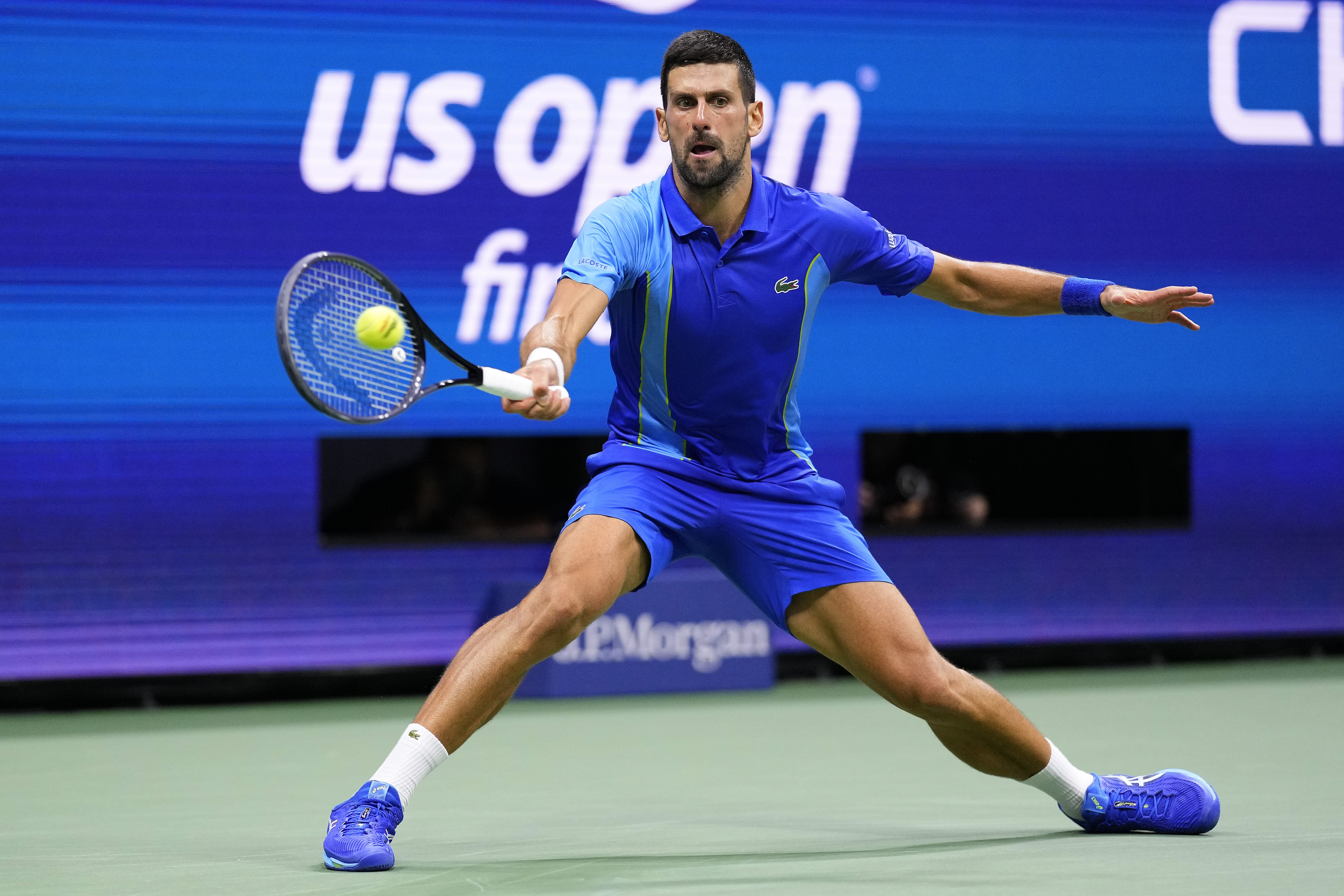 Novak Djokovic, of Serbia, returns a shot to Daniil Medvedev, of Russia, during the men's singles final of the U.S. Open tennis championships, Sunday, Sept. 10, 2023, in New York. (AP Photo/Manu Fernandez)