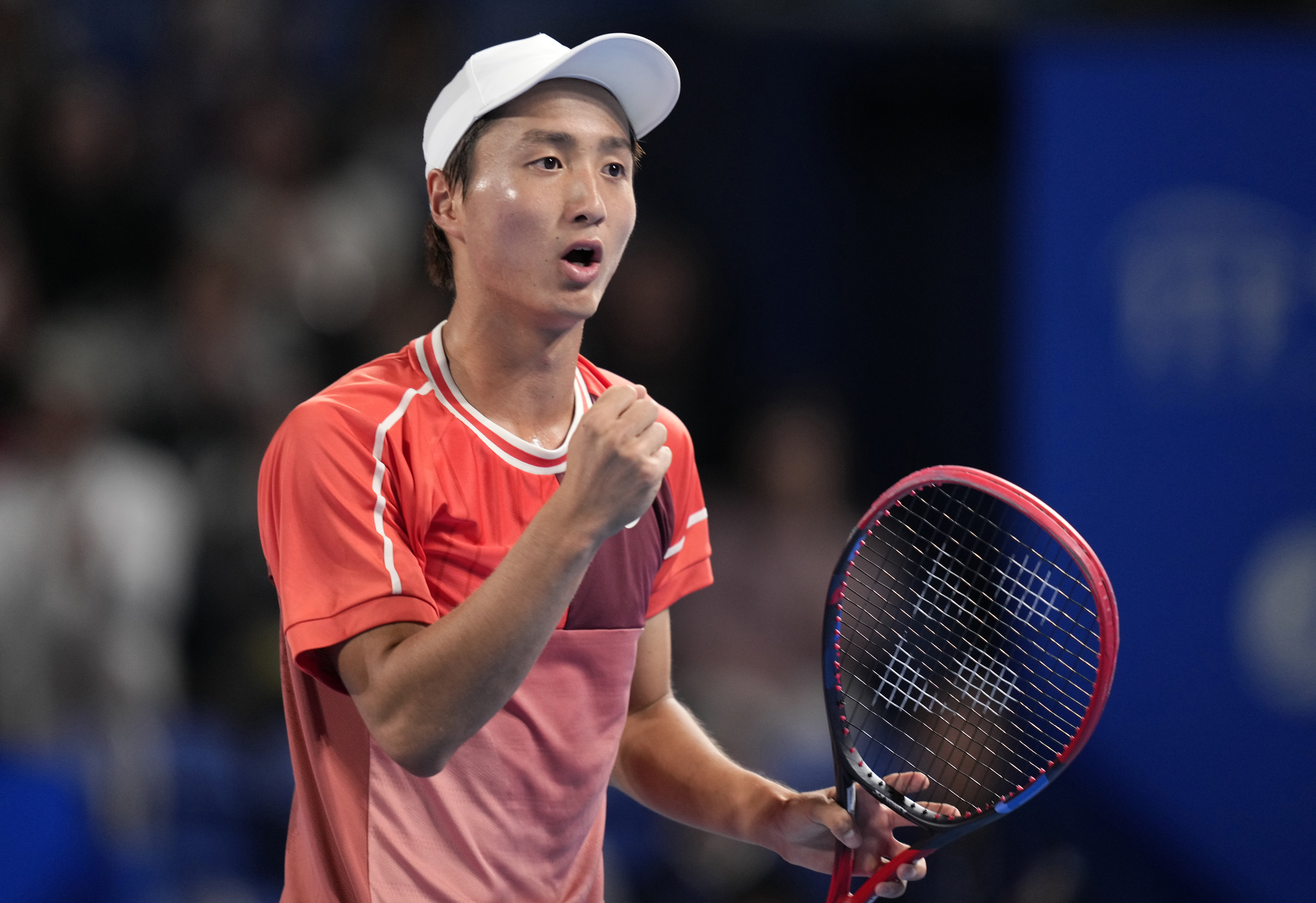 epa10928783 Shintaro Mochizuki of Japan reacts after scoring against Alexei Popyrin of Australia during their mens singles quarterfinals match of the Japan Open tennis tournament in Tokyo, Japan, 20 October 2023.  EPA-EFE/FRANCK ROBICHON