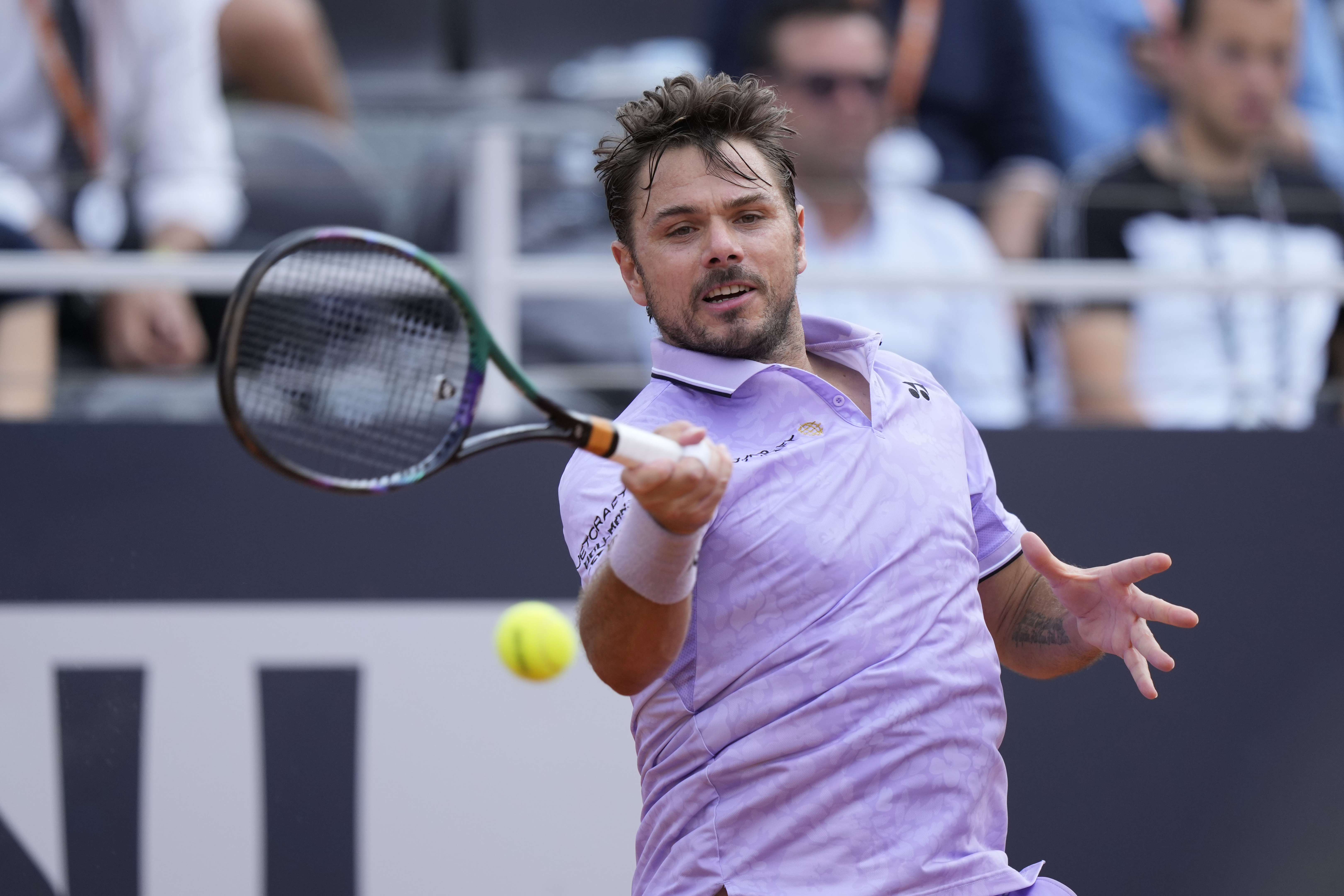 Switzerland's Stan Wawrinka returns the ball to Bulgaria's Grigor Dimitrov during their match at the Italian Open tennis tournament, in Rome, Friday, May 12, 2023. (AP Photo/Andrew Medichini)
