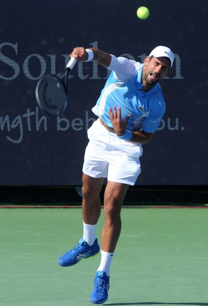 epa10811074 Novak Djokovic of Serbia serves to to Alexander Zverev of Germany during the semi-final round of the Western and Southern Open at the Lindner Family Tennis Center in Mason, Ohio, USA, 20 August 2023.  EPA-EFE/MARK LYONS