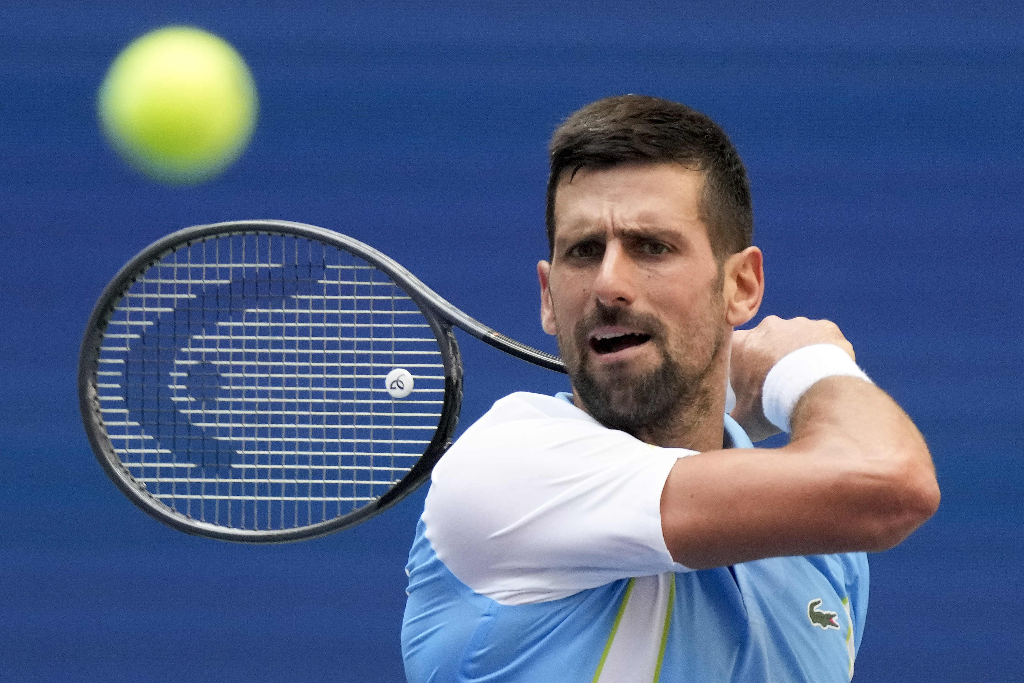 Novak Djokovic, of Serbia, returns a shot to Bernabe Zapata Miralles, of Spain, during the second round of the U.S. Open tennis championships, Wednesday, Aug. 30, 2023, in New York. (AP Photo/John Minchillo)