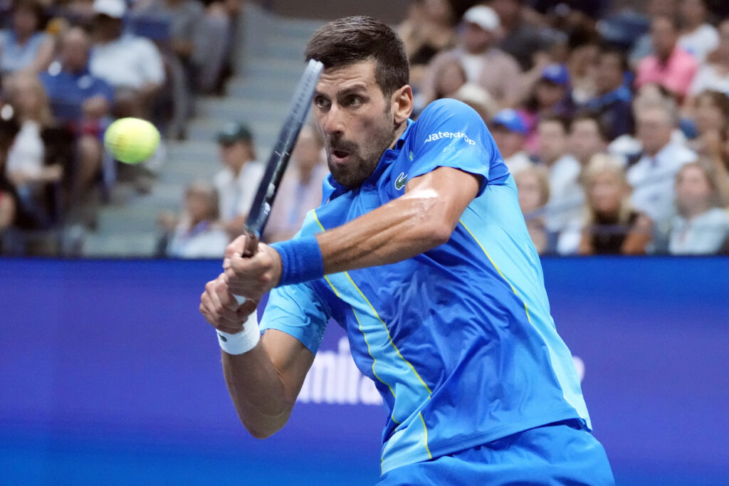 Novak Djokovic, of Serbia, returns to Borna Gojo, of Croatia, during the fourth round of the U.S. Open tennis championships, Sunday, Sept. 3, 2023, in New York. (AP Photo/John Minchillo)