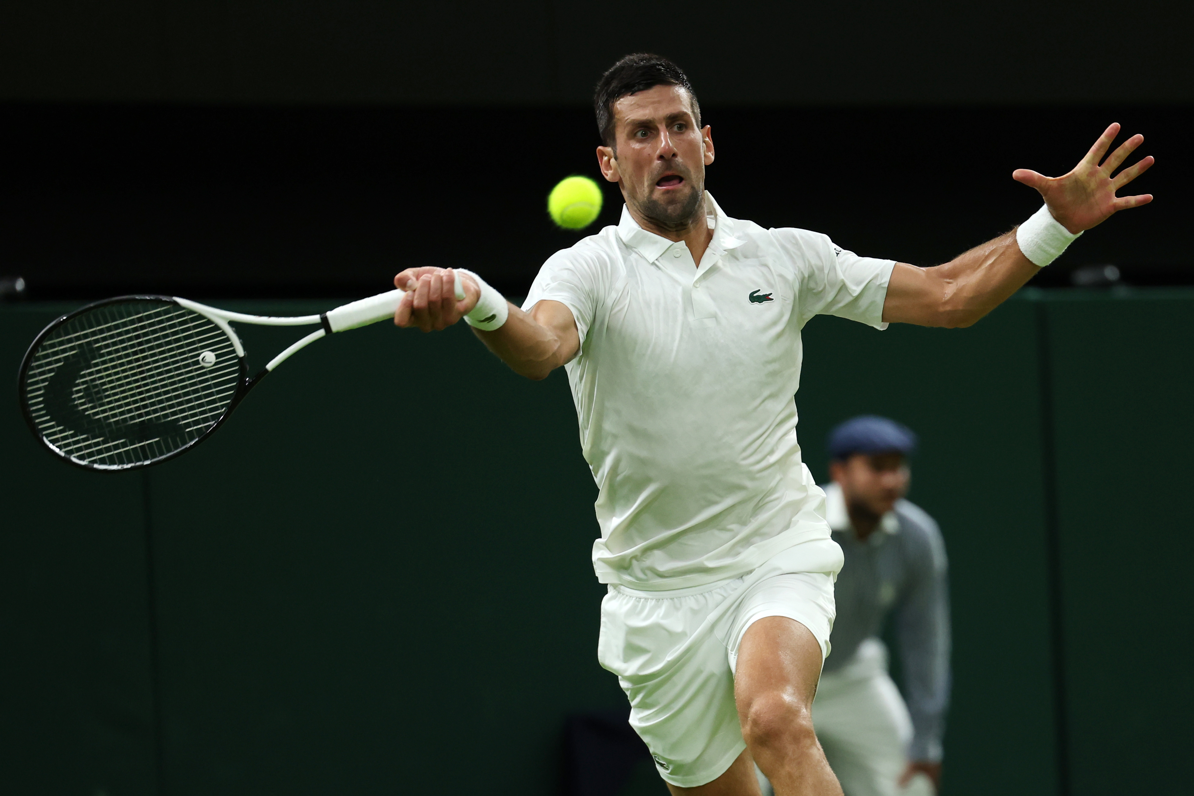 epa10733179 Novak Djokovic of Serbia in action against Stan Wawrinka of Switzerland in their Men's Singles match at the Wimbledon Championships, Wimbledon, Britain, 07 July 2023.  EPA-EFE/NEIL HALL   EDITORIAL USE ONLY
