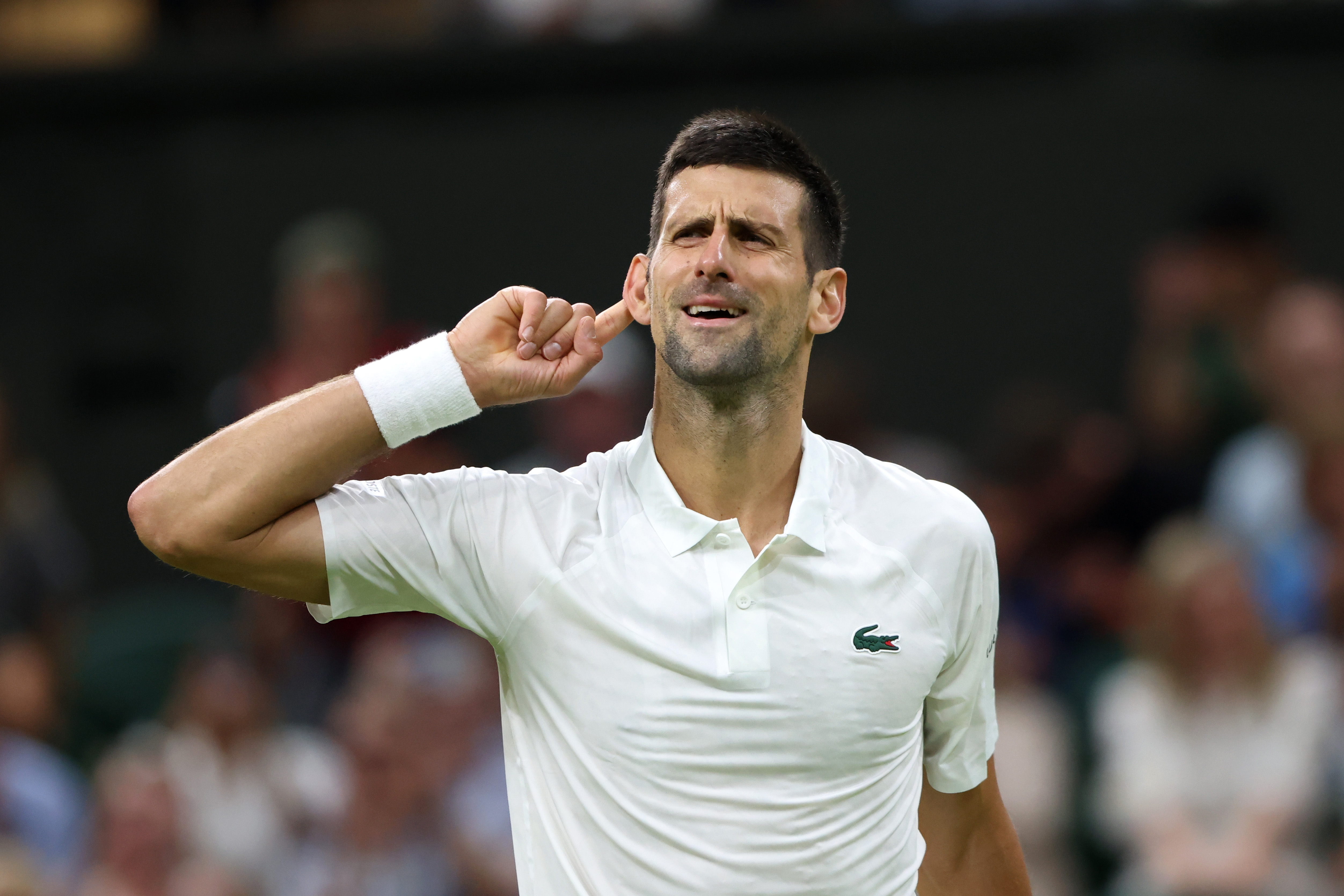 epa10733333 Novak Djokovic of Serbia reacts after winning against Stan Wawrinka of Switzerland in their Men's Singles match at the Wimbledon Championships, Wimbledon, Britain, 07 July 2023.  EPA-EFE/NEIL HALL   EDITORIAL USE ONLY