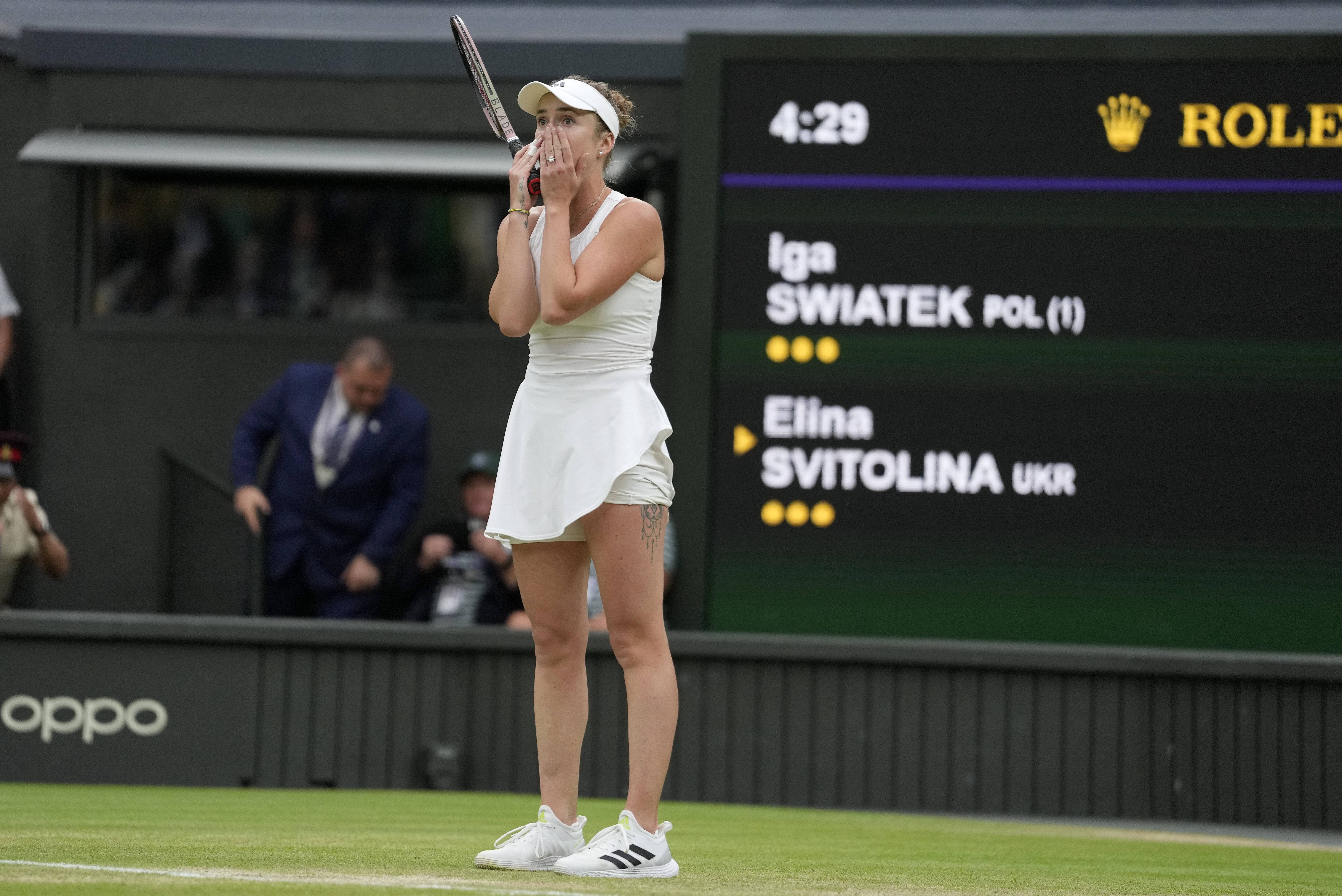 Ukraine's Elina Svitolina celebrates after beating Poland's Iga Swiatek to win their women's singles match on day nine of the Wimbledon tennis championships in London, Tuesday, July 11, 2023. (AP Photo/Kirsty Wigglesworth)