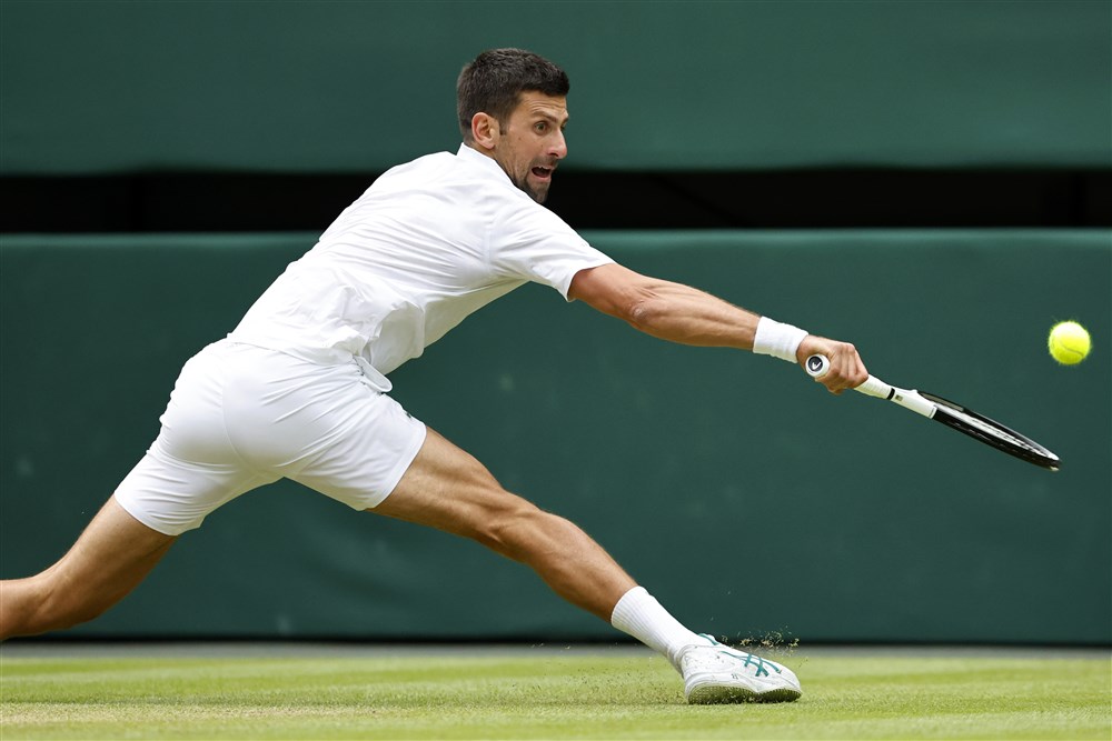 epa10740292 Novak Djokovic of Serbia in action against Andrey Rublev of Russia during their Men's Singles quarter final match at the Wimbledon Championships, Wimbledon, Britain, 11 July 2023.  EPA-EFE/TOLGA AKMEN   EDITORIAL USE ONLY