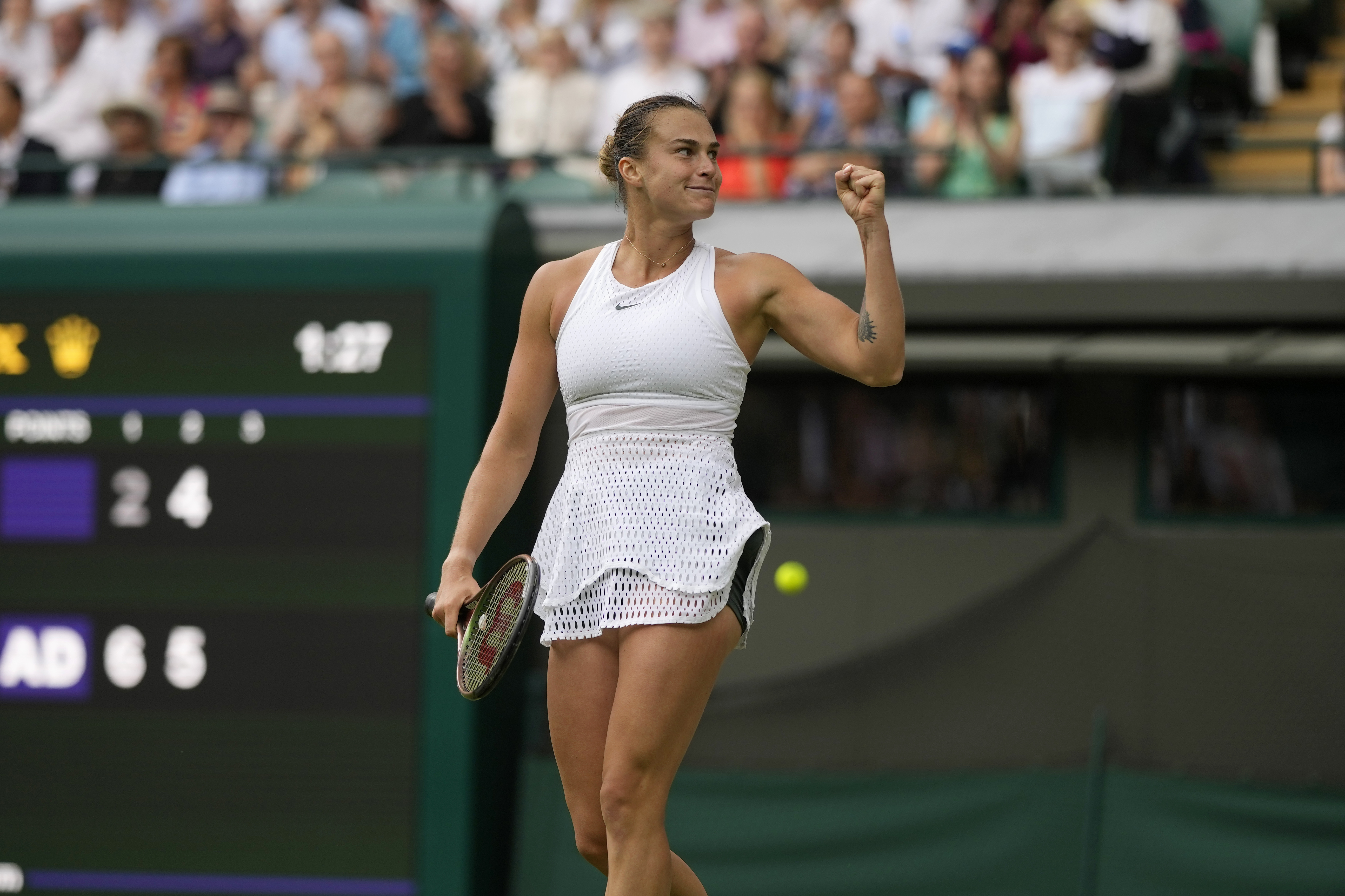Aryna Sabalenka of Belarus celebrates after beating Madison Keys of the US in the women's singles match on day ten of the Wimbledon tennis championships in London, Wednesday, July 12, 2023. (AP Photo/Alastair Grant)