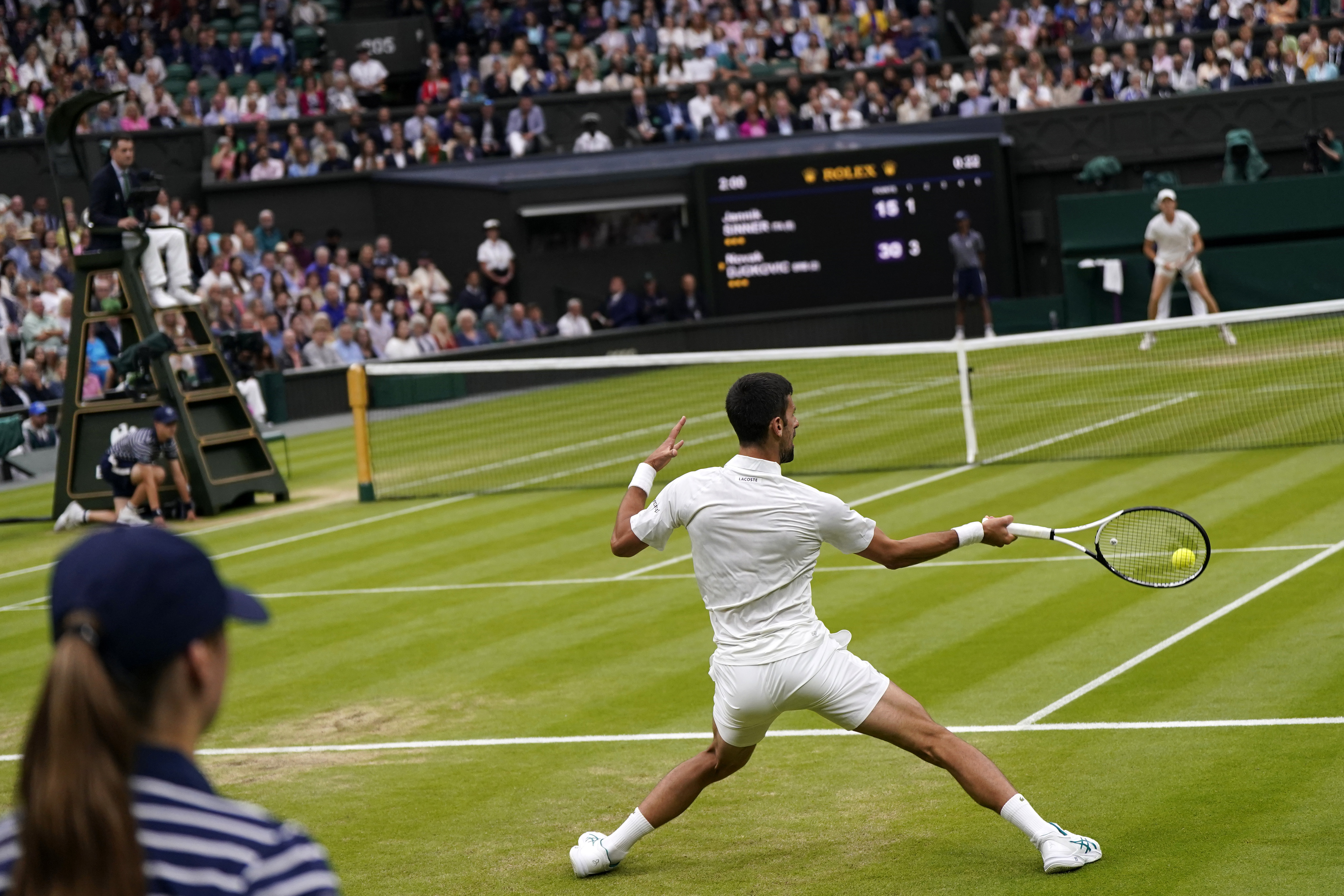 Serbia's Novak Djokovic in action against Italy's Jannik Sinner during their men's singles semifinal match on day twelve of the Wimbledon tennis championships in London, Friday, July 14, 2023. (AP Photo/Alberto Pezzali)