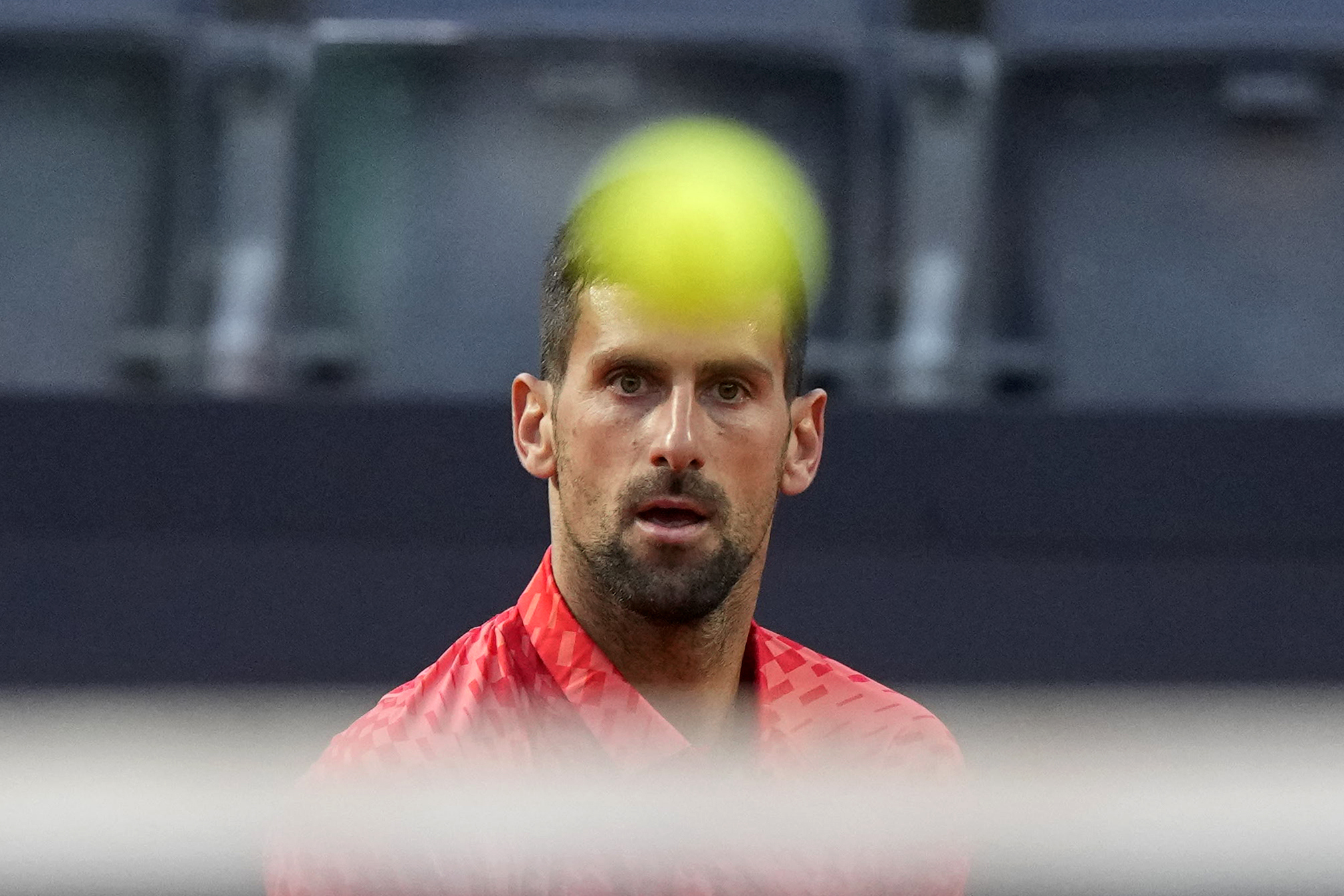 Serbia's Novak Djokovic returns the ball to Argentina's Tomas Etcheverry during their match at the Italian Open tennis tournament, in Rome, Friday, May 12, 2023. (AP Photo/Andrew Medichini)
