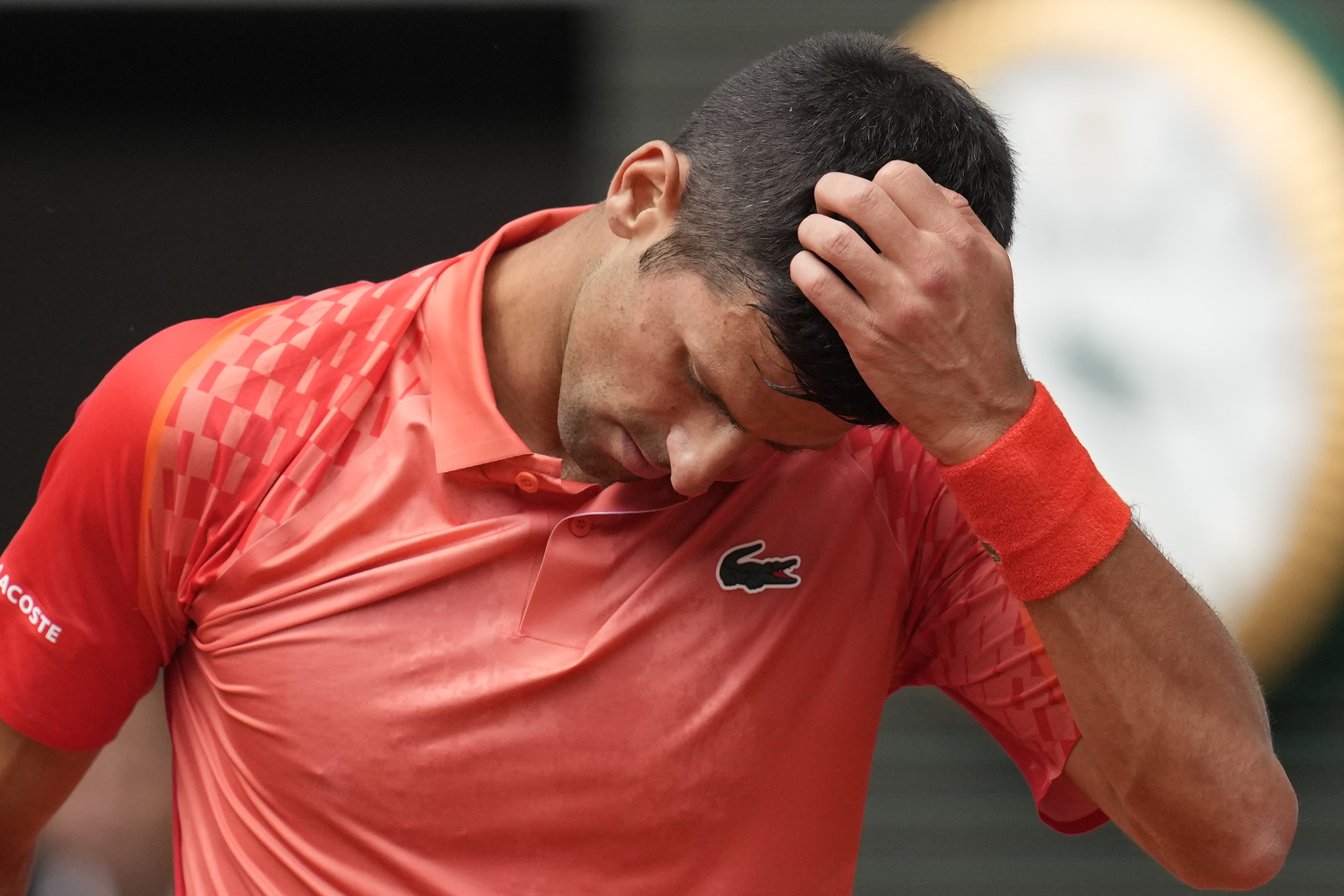 Serbia's Novak Djokovic reacts after missing a shot against Norway's Casper Ruud during the men's singles final match of the French Open tennis tournament at the Roland Garros stadium in Paris, Sunday, June 11, 2023. (AP Photo/Christophe Ena)