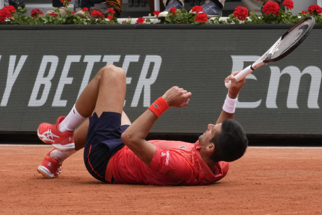 Serbia's Novak Djokovic slips on the clay court during the men's singles final match of the French Open tennis tournament against Norway's Casper Ruud at the Roland Garros stadium in Paris, Sunday, June 11, 2023. (AP Photo/Christophe Ena)