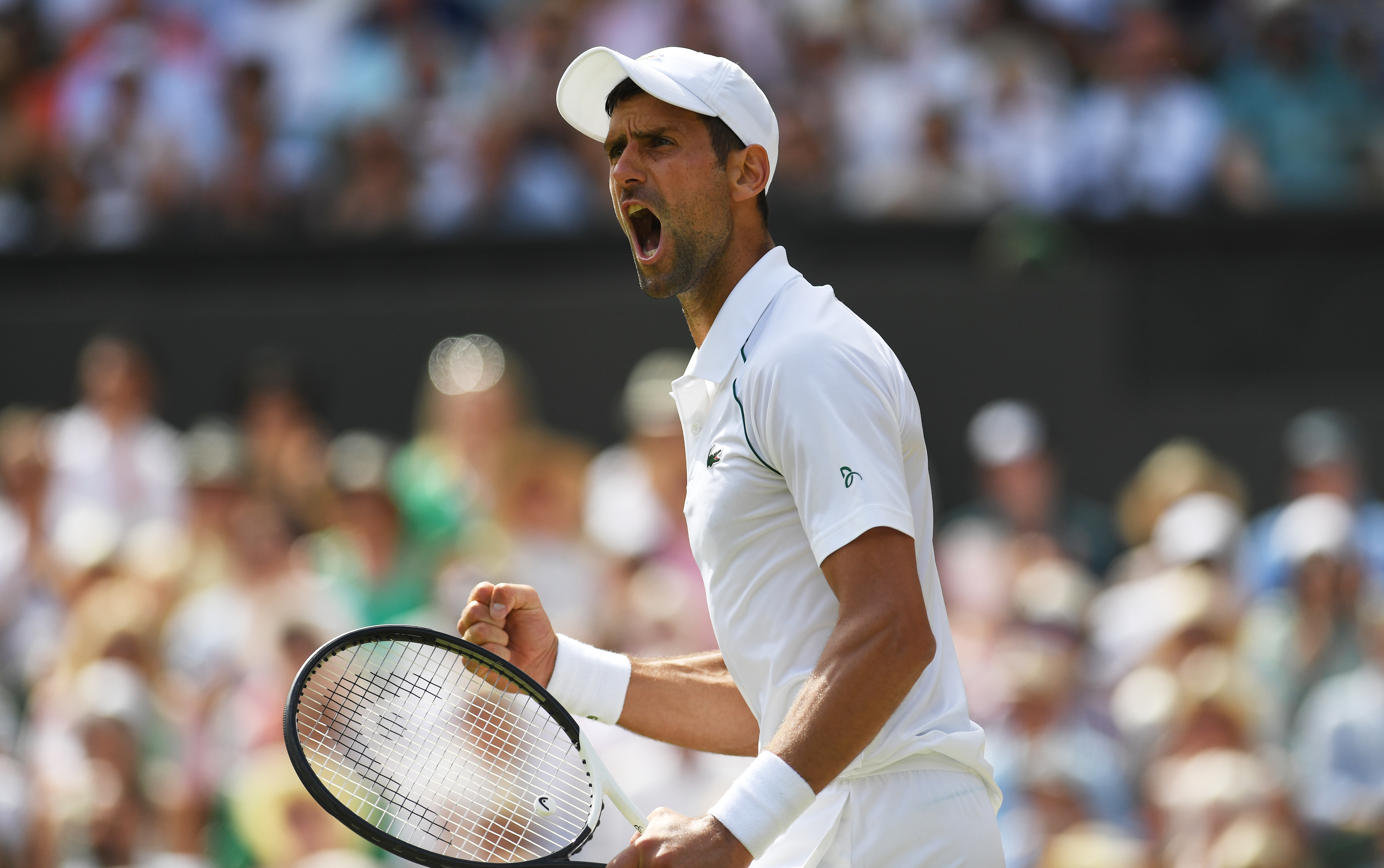epa10063718 Novak Djokovic of Serbia celebrates winning the second set in the men's final match against Nick Kyrgios of Australia at the Wimbledon Championships, in Wimbledon, Britain, 10 July 2022.  EPA-EFE/NEIL HALL   EDITORIAL USE ONLY