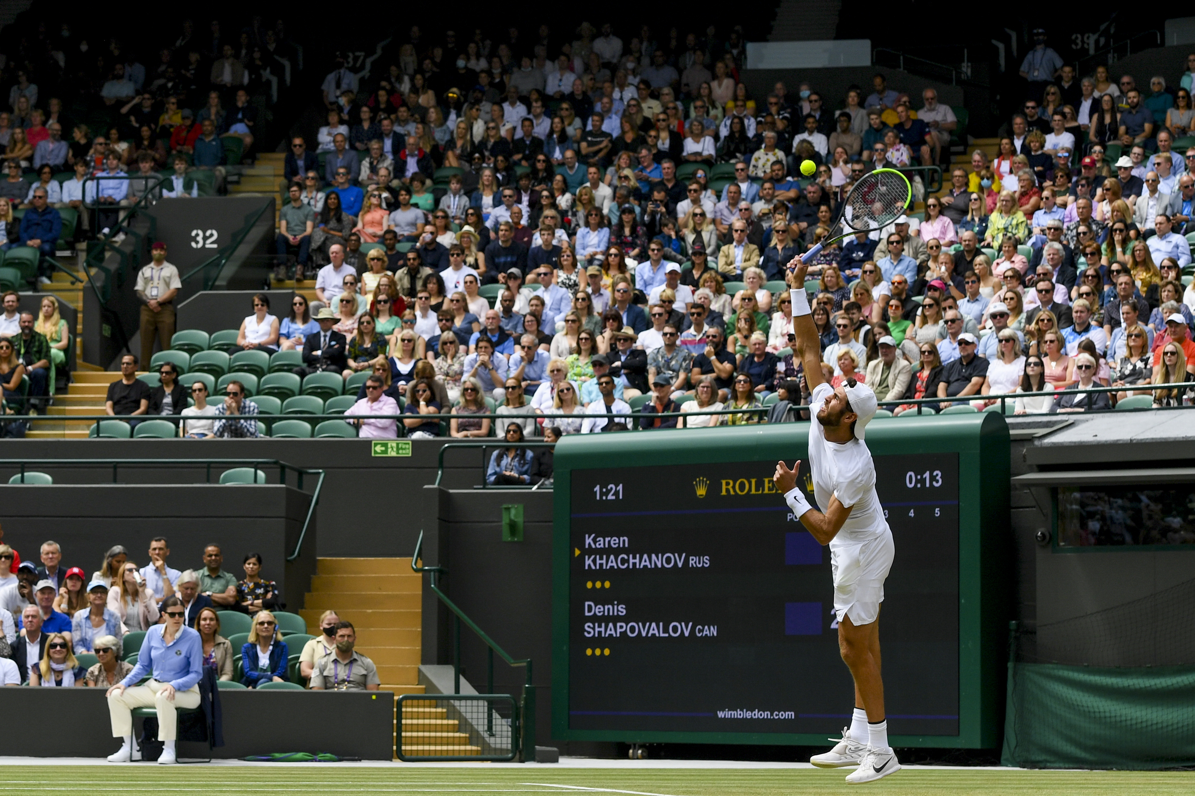 epa09328483 Karen Khachanov of Russia in action against Denis Shapovalov of Canada during the men's quarter final match at the Wimbledon Championships, Wimbledon, Britain, 07 July 2021.  EPA-EFE/FACUNDO ARRIZABALAGA   EDITORIAL USE ONLY