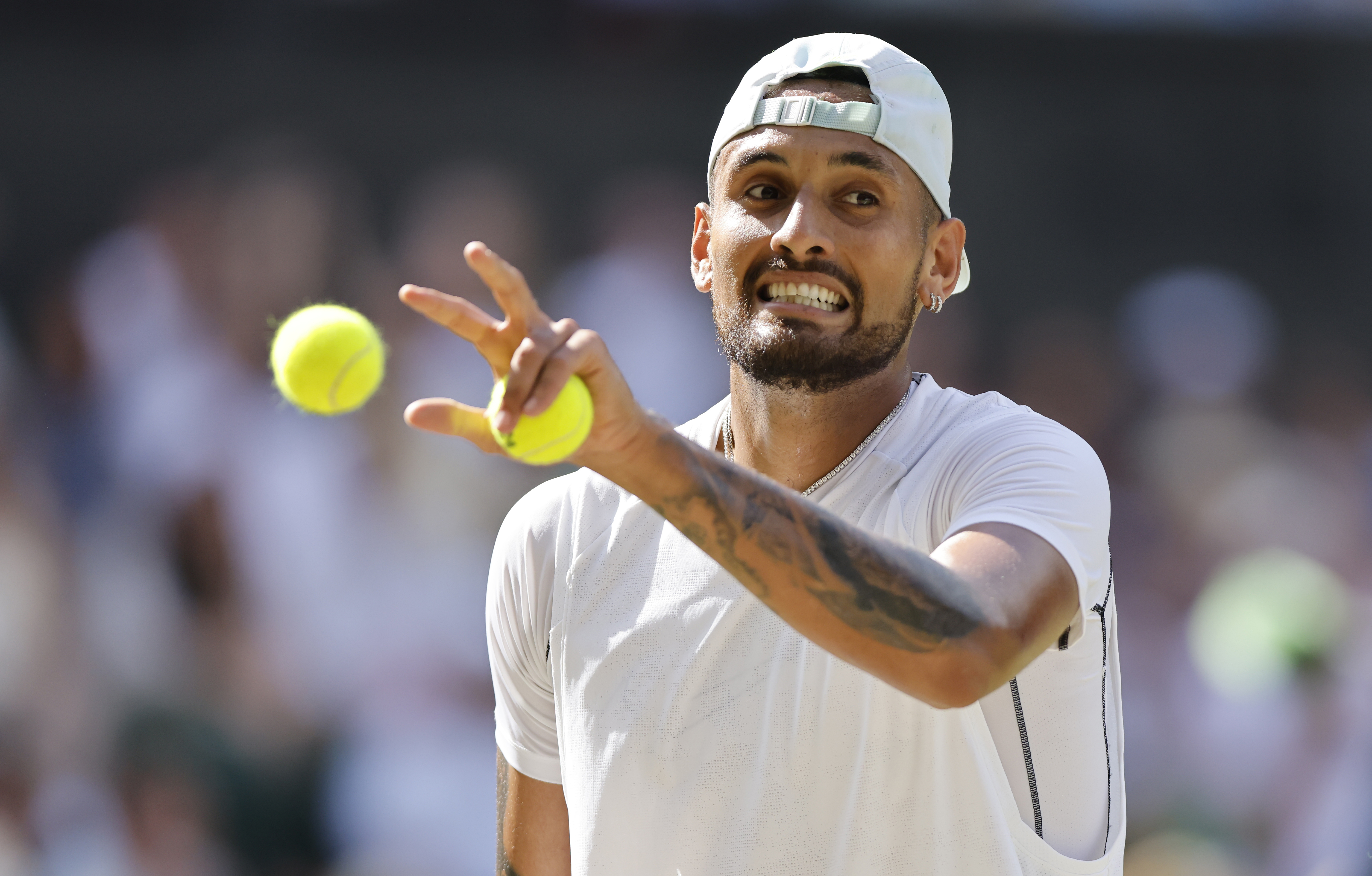 epa10063984 Nick Kyrgios of Australia prepares to serve in the men's final match against Novak Djokovic of Serbia at the Wimbledon Championships, in Wimbledon, Britain, 10 July 2022.  EPA-EFE/TOLGA AKMEN   EDITORIAL USE ONLY