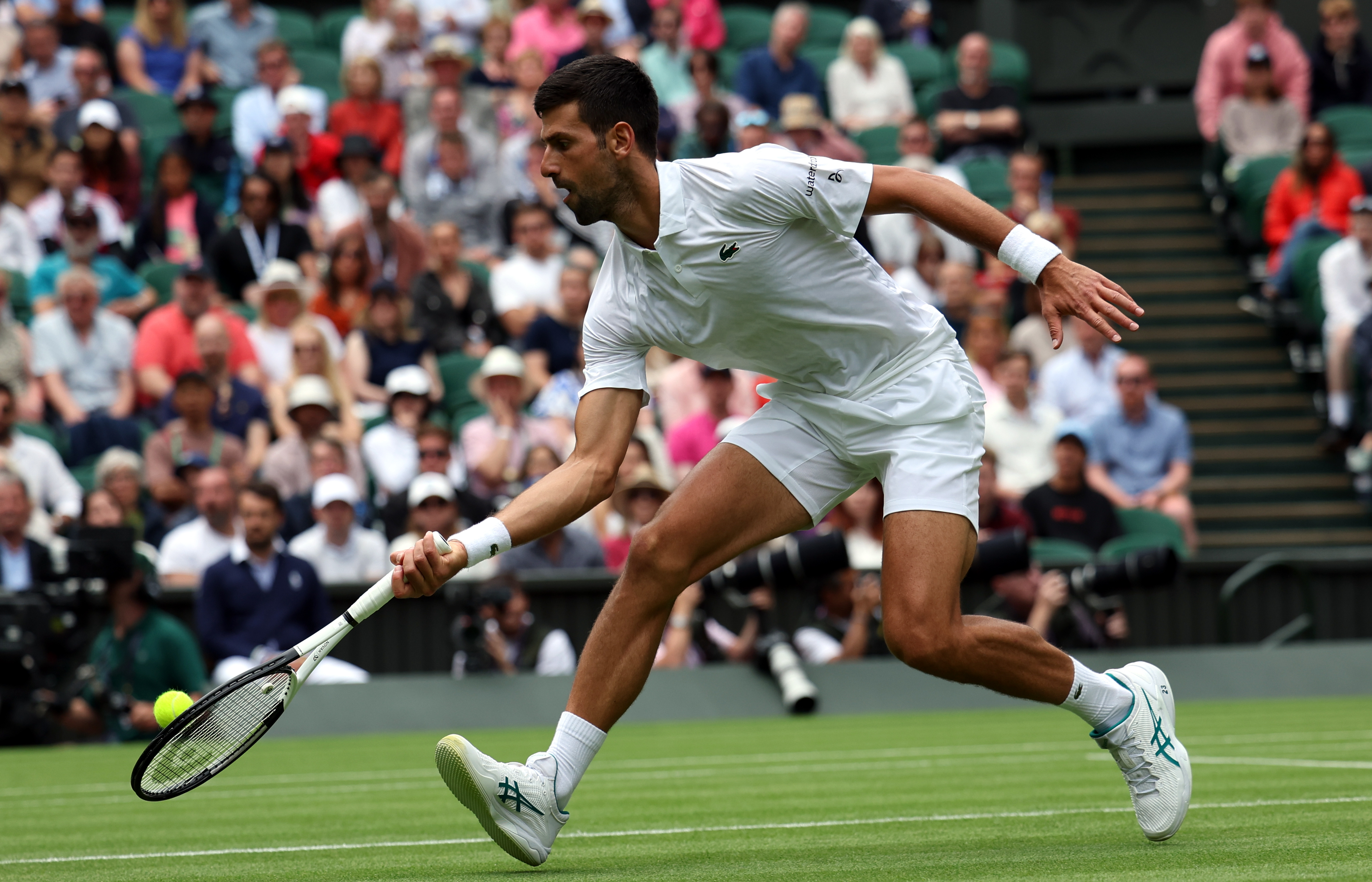 epa10724275 Novak Djokovic of Serbia plays Pedro Cachin of Argentina in their 1st round match at the Wimbledon Championships, Wimbledon, Britain, 03 July 2023.  EPA-EFE/NEIL HALL   EDITORIAL USE ONLY  EDITORIAL USE ONLY