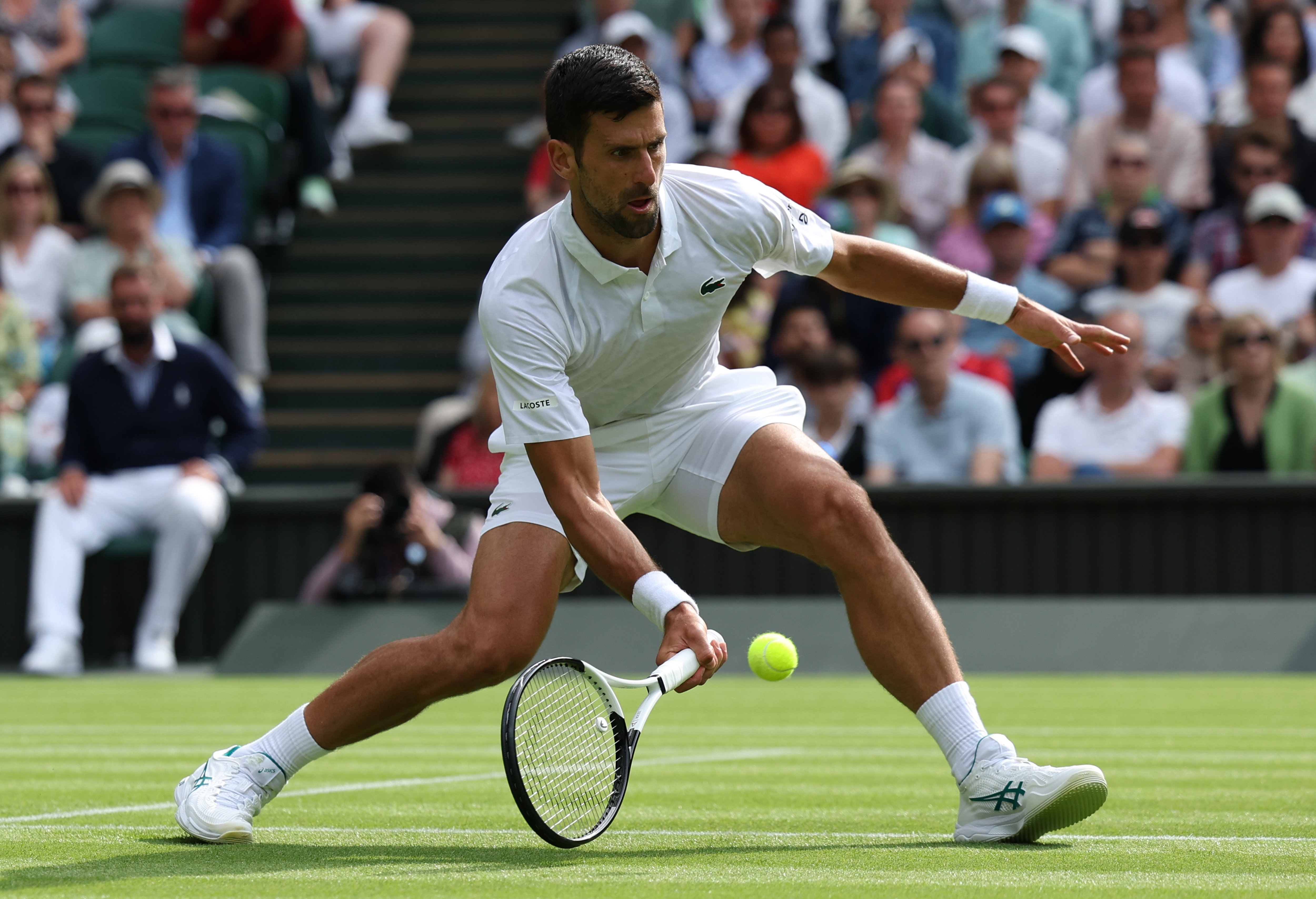 epa10724343 Novak Djokovic of Serbia plays Pedro Cachin of Argentina in their 1st round match at the Wimbledon Championships, Wimbledon, Britain, 03 July 2023.  EPA-EFE/NEIL HALL   EDITORIAL USE ONLY  EDITORIAL USE ONLY