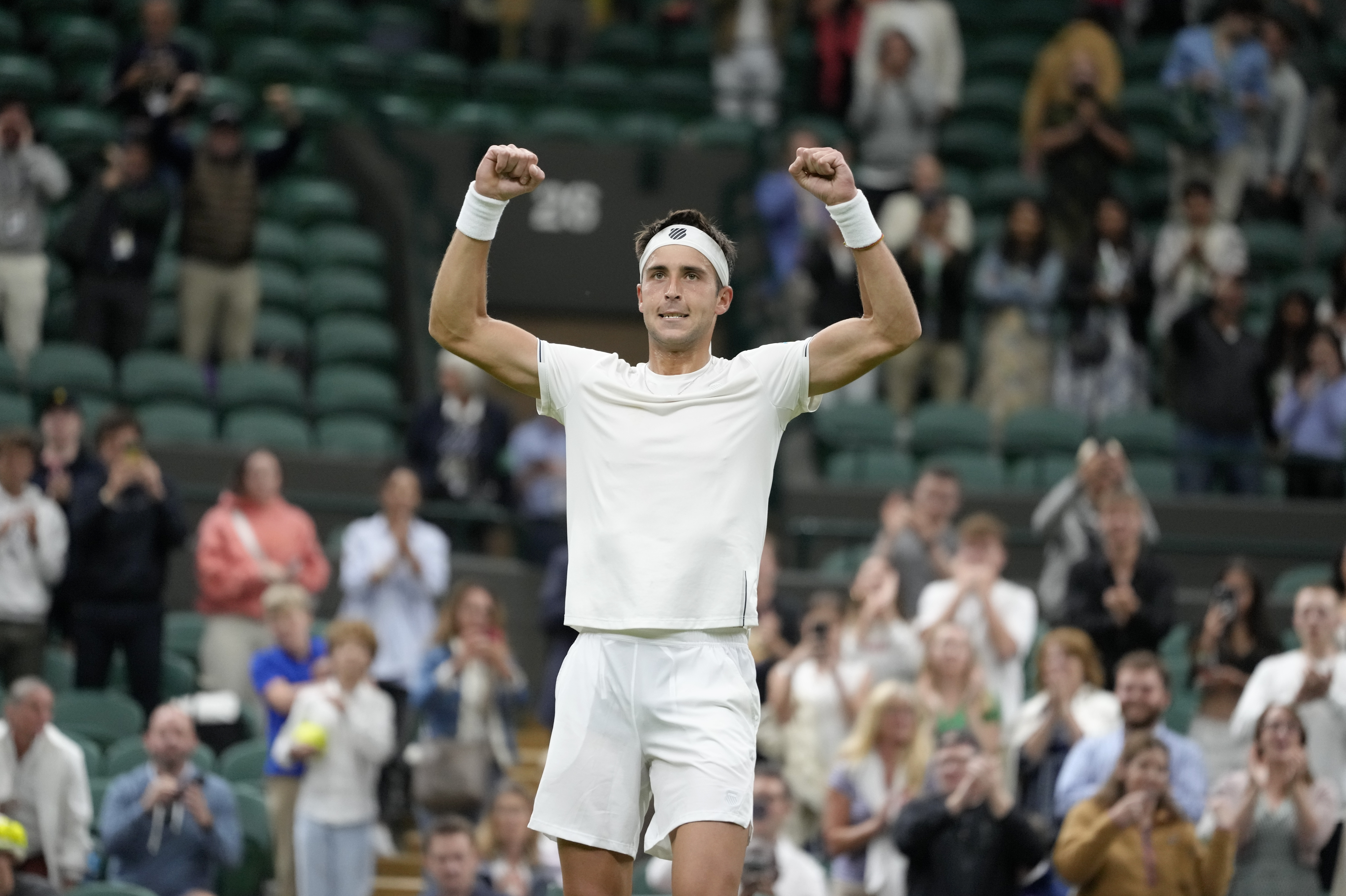 Argentina's Tomas Martín Etcheverry celebrates after beating Spain's Bernabe Zapata Miralles in a first round men's singles match on day two of the Wimbledon tennis championships in London, Tuesday, July 4, 2023. (AP Photo/Kirsty Wigglesworth)