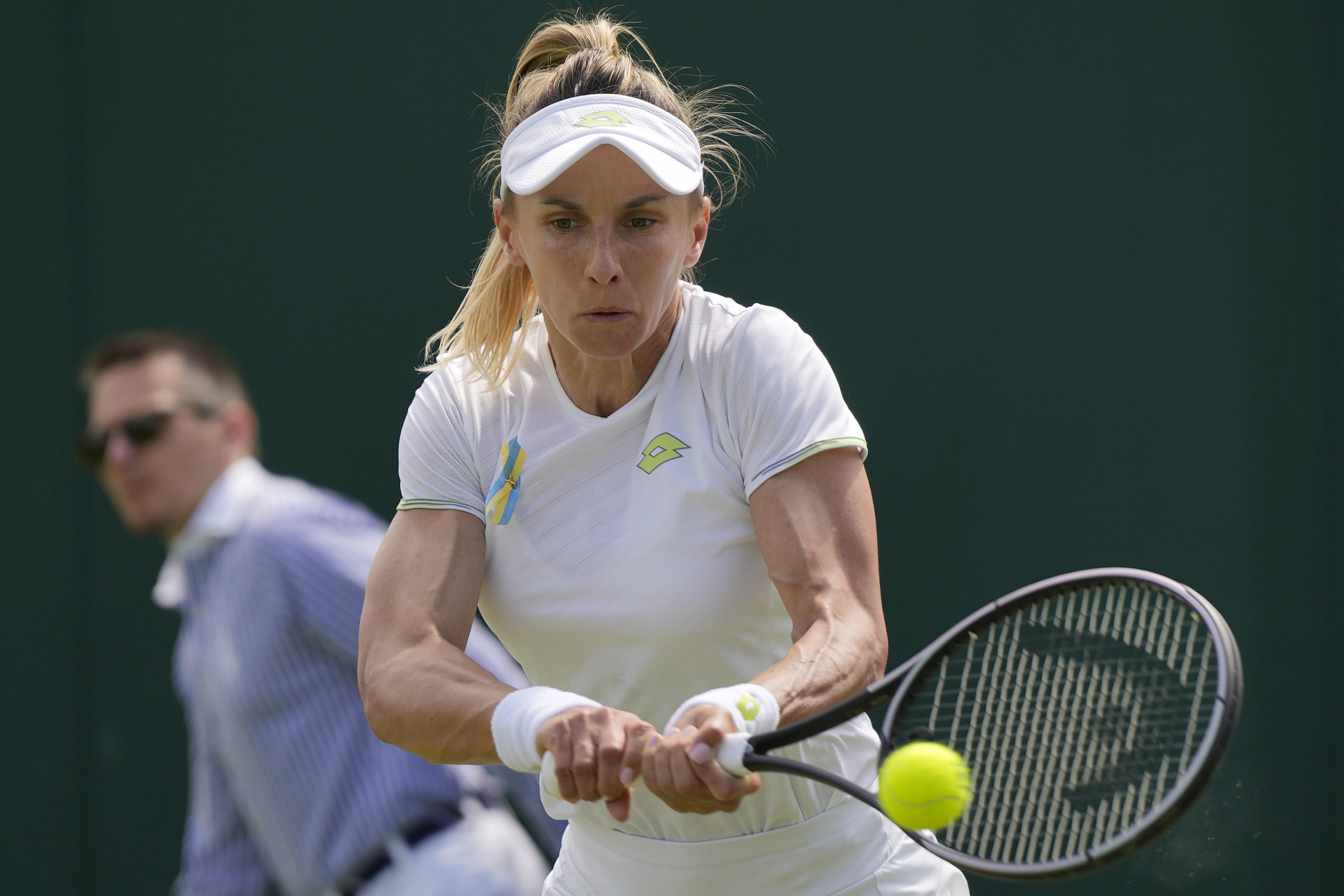 Ukraine's Lesia Tsurenko plays a return to Czech Republic's Katerina Siniakova during the women's singles match on day four of the Wimbledon tennis championships in London, Thursday, July 6, 2023. (AP Photo/Alastair Grant)