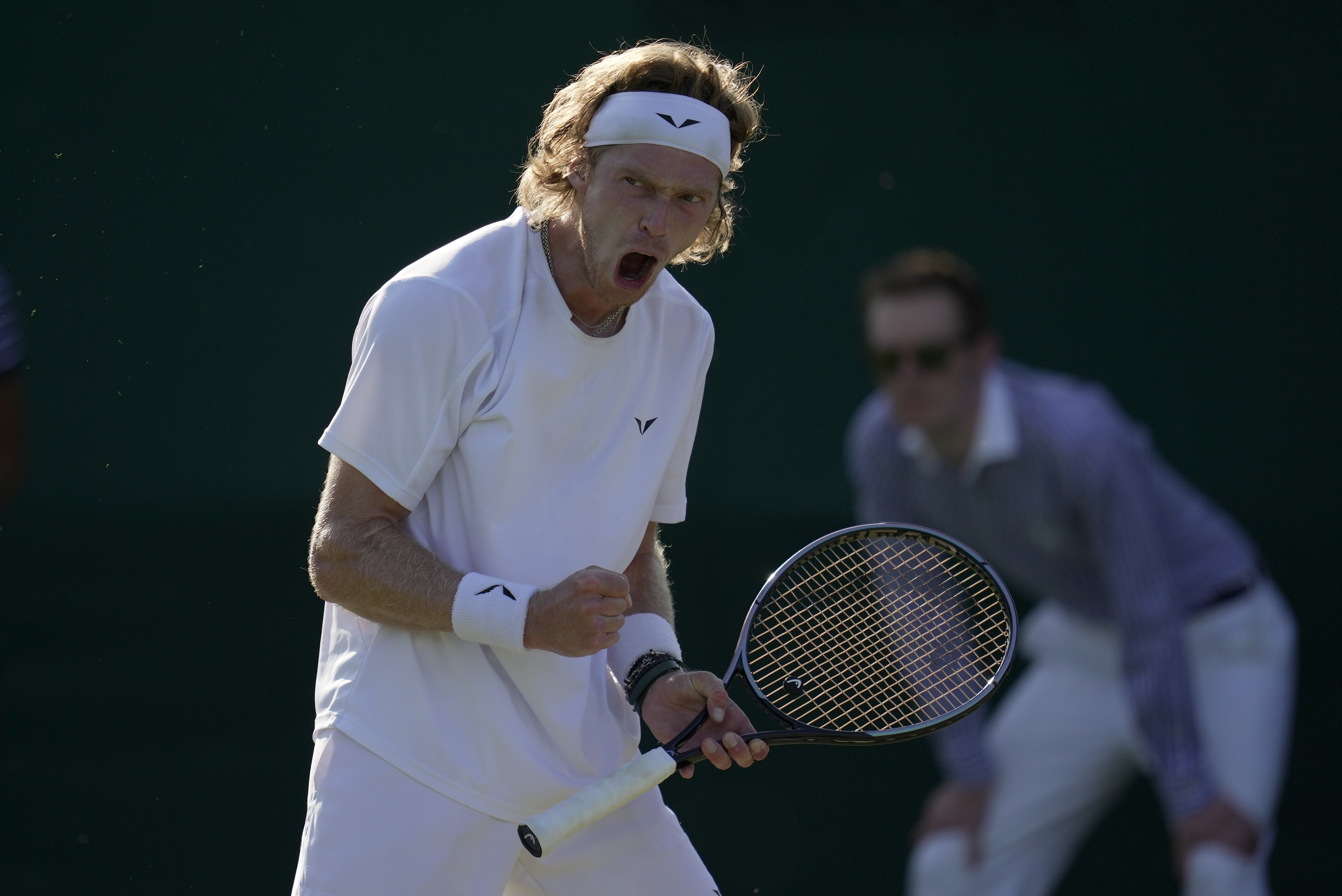 Russia's Andrey Rublev reacts as he wins a point against Belgium's David Goffin in a men's singles match on day five of the Wimbledon tennis championships in London, Friday, July 7, 2023. (AP Photo/Kin Cheung)