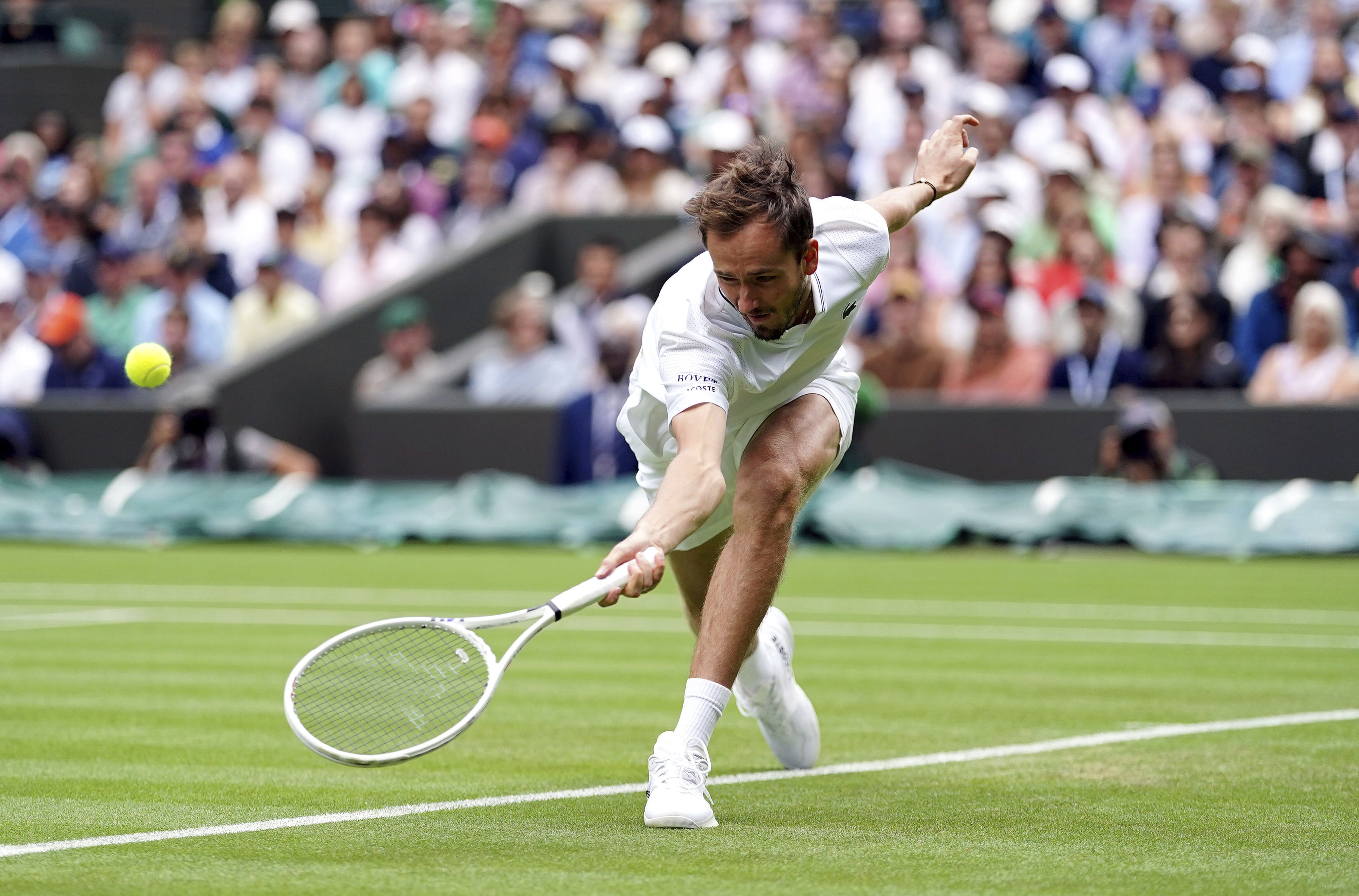 Russia's Daniil Medvedev returns to Britain's Arthur Fery in a first round men’s singles match on day three of the Wimbledon tennis championships in London, Wednesday, July 5, 2023.  (Zac Goodwin/PA via AP)