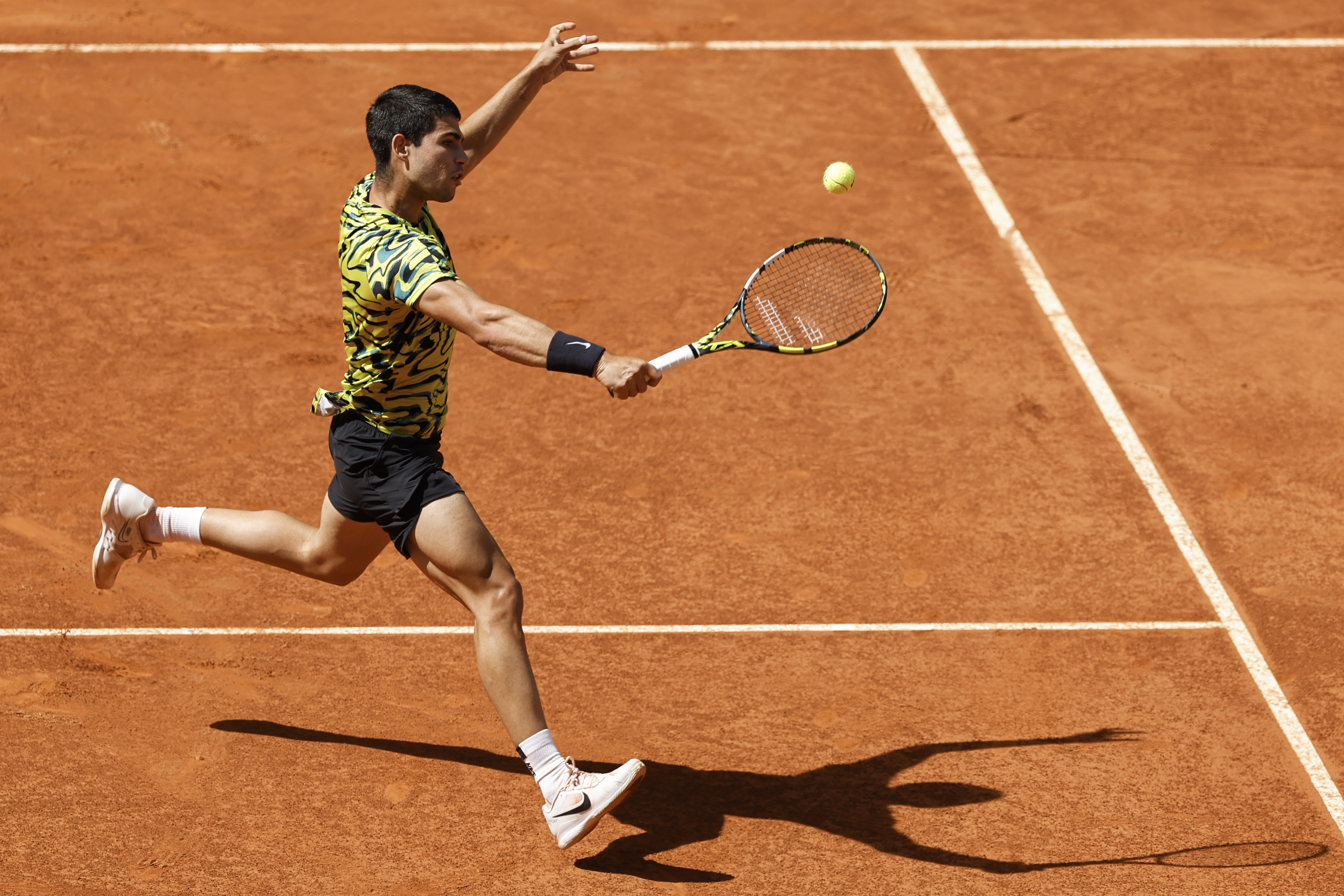 epaselect epa10610504 Spanish tennis player Carlos Alcaraz in action against Croatian Borna Coric during their Mutua Madrid Open semi final tennis match held at the Magic Box, in Madrid, Spain, 05 May 2023.  EPA-EFE/Chema Moya