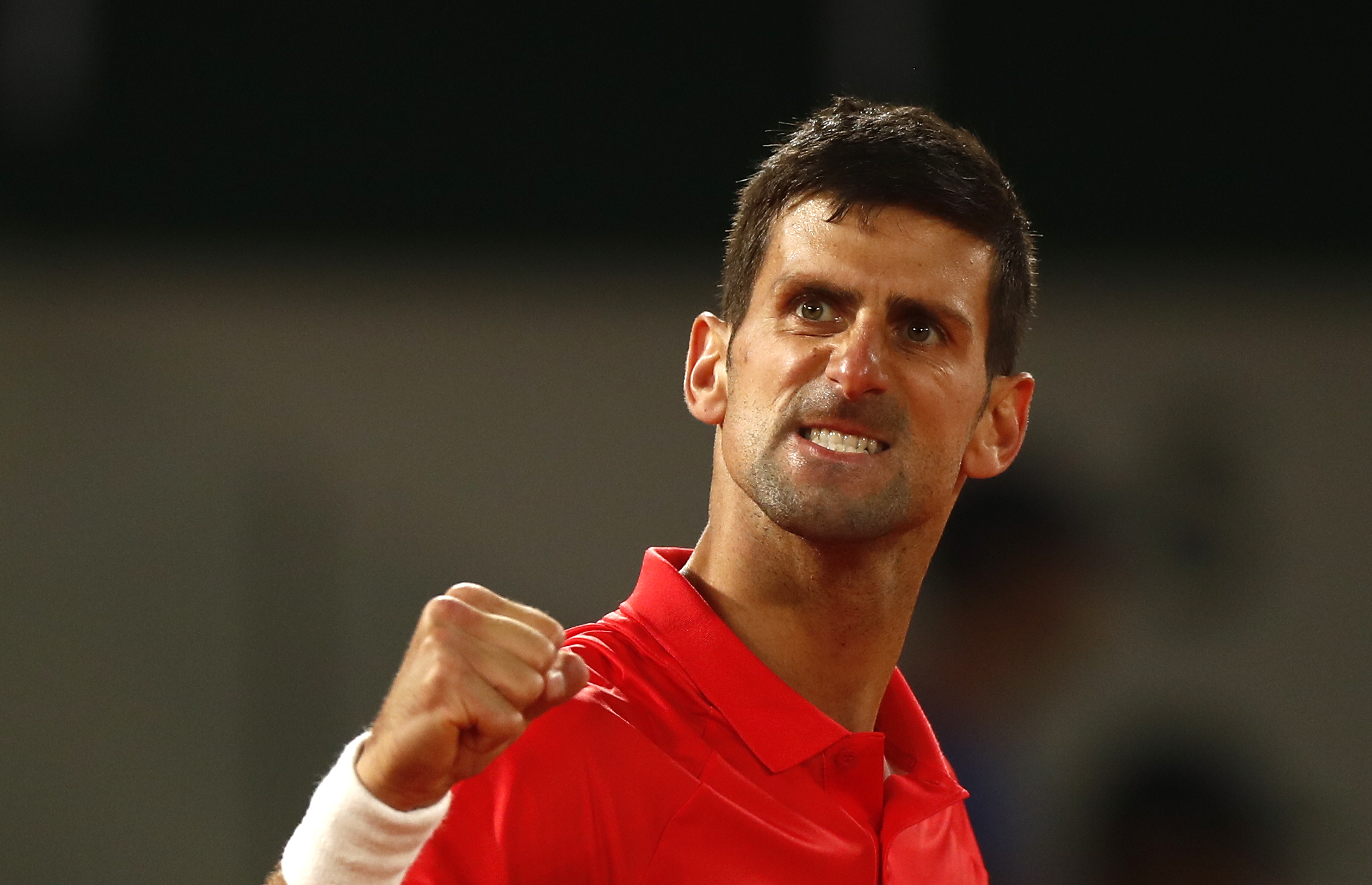epa09988834 Novak Djokovic of Serbia reacts as he plays Rafael Nadal of Spain in their men’s quarterfinal match during the French Open tennis tournament at Roland ​Garros in Paris, France, 01 June 2022.  EPA-EFE/MOHAMMED BADRA