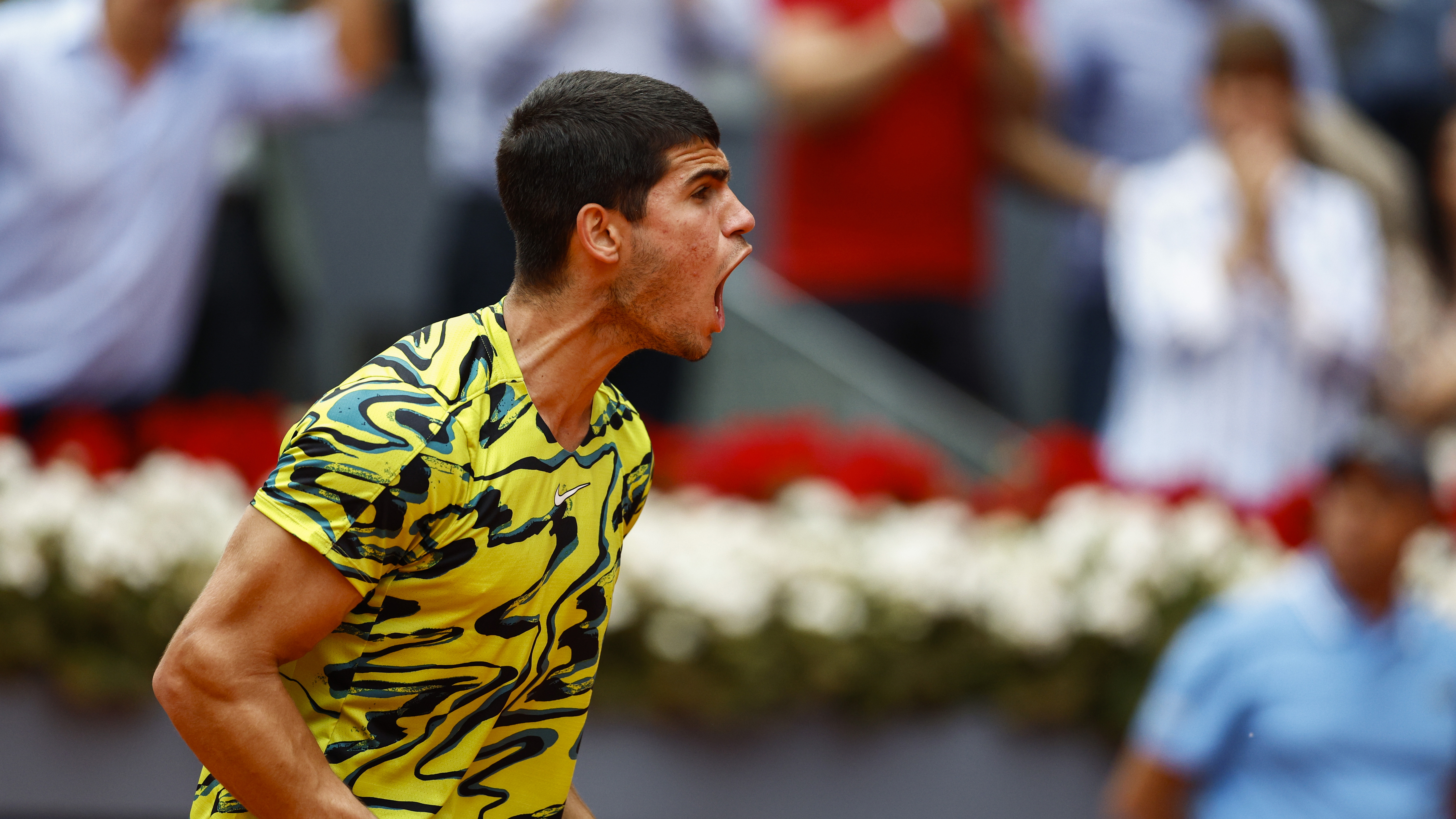 epa10597193 Carlos Alcaraz of Spain reacts after defeating Emil Ruusuvuori of Finland during their round of 64 match at the Madrid Open tennis tournament in Madrid, Spain, 28 April 2023.  EPA-EFE/Rodrigo Jimenez