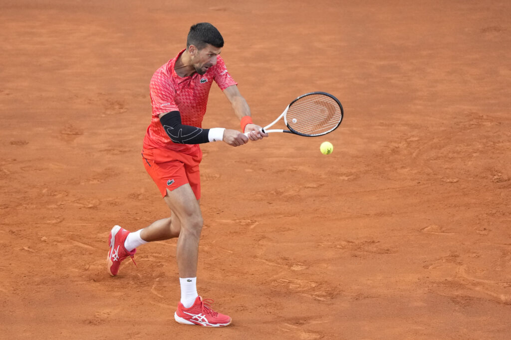 Serbia's Novak Djokovic returns the ball to Argentina's Tomas Etcheverry during their match at the Italian Open tennis tournament, in Rome, Friday, May 12, 2023. (AP Photo/Andrew Medichini)