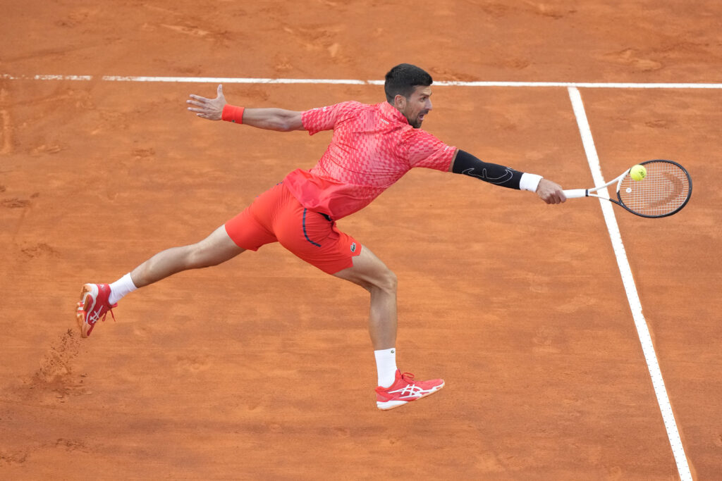 Serbia's Novak Djokovic returns the ball to Argentina's Tomas Etcheverry during their match at the Italian Open tennis tournament, in Rome, Friday, May 12, 2023. (AP Photo/Andrew Medichini)