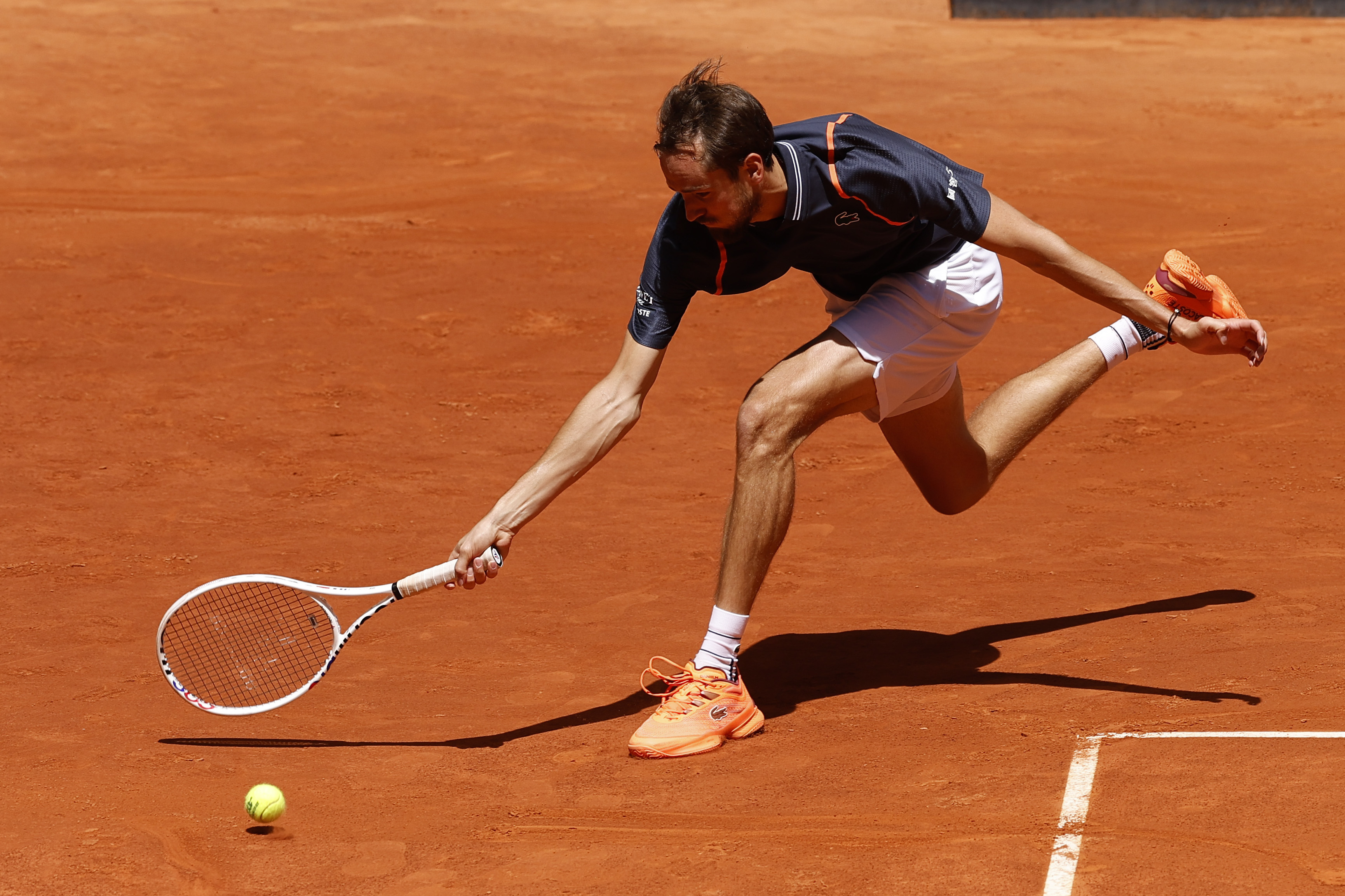 epa10604045 Russian tennis player Daniil Medvedev in action against his fellow countryman Aslan Karatsev during their round of 16 match at the Madrid Open tennis tournament, in Madrid, Spain, 02 May 2023.  EPA-EFE/Chema Moya