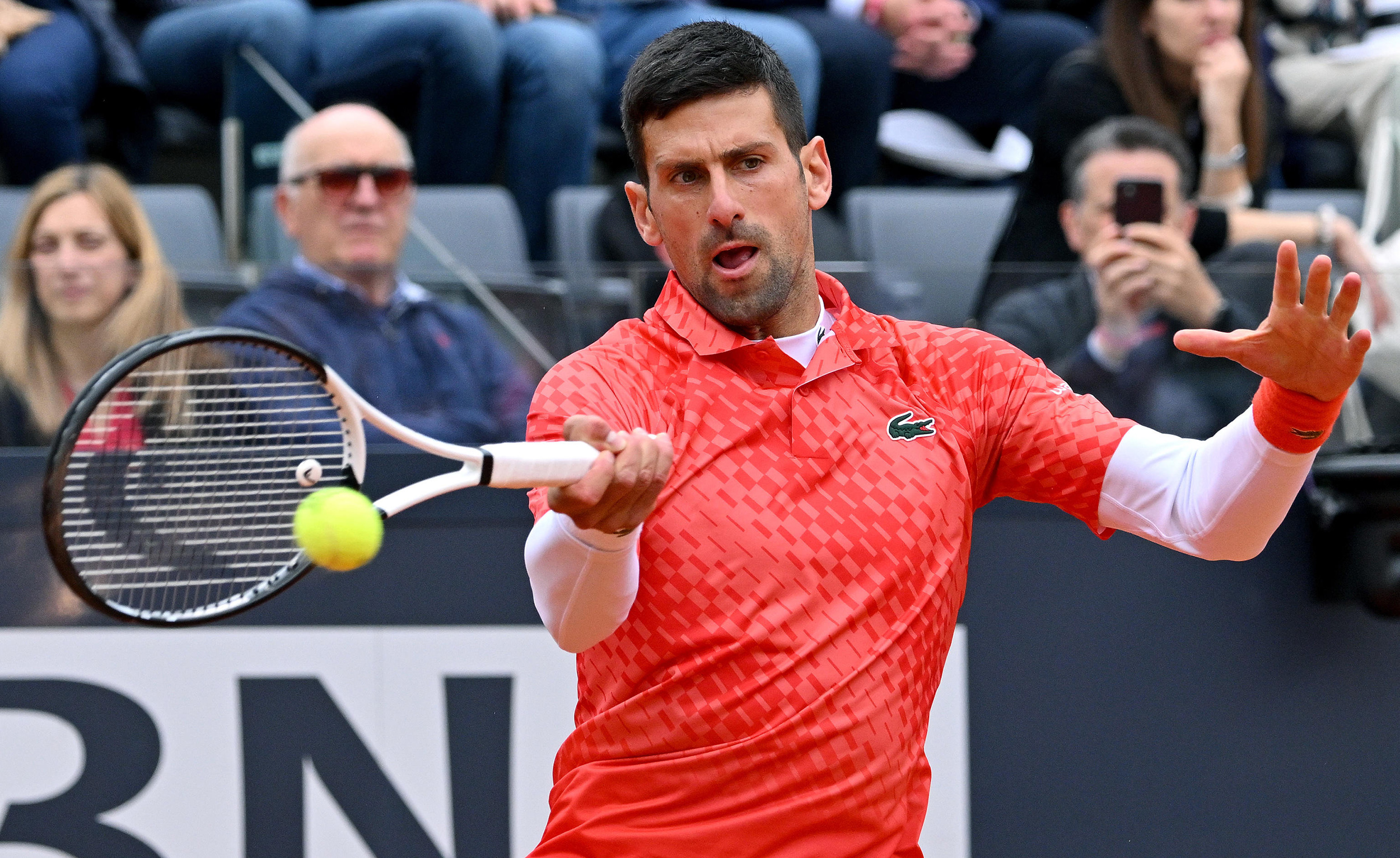epa10633708 Novak Djokovic of Serbia in action during his men's quarter final round match against Holger Rune of Denmark (not pictured) at the Italian Open tennis tournament in Rome, Italy, 17 May 2023.  EPA-EFE/ETTORE FERRARI