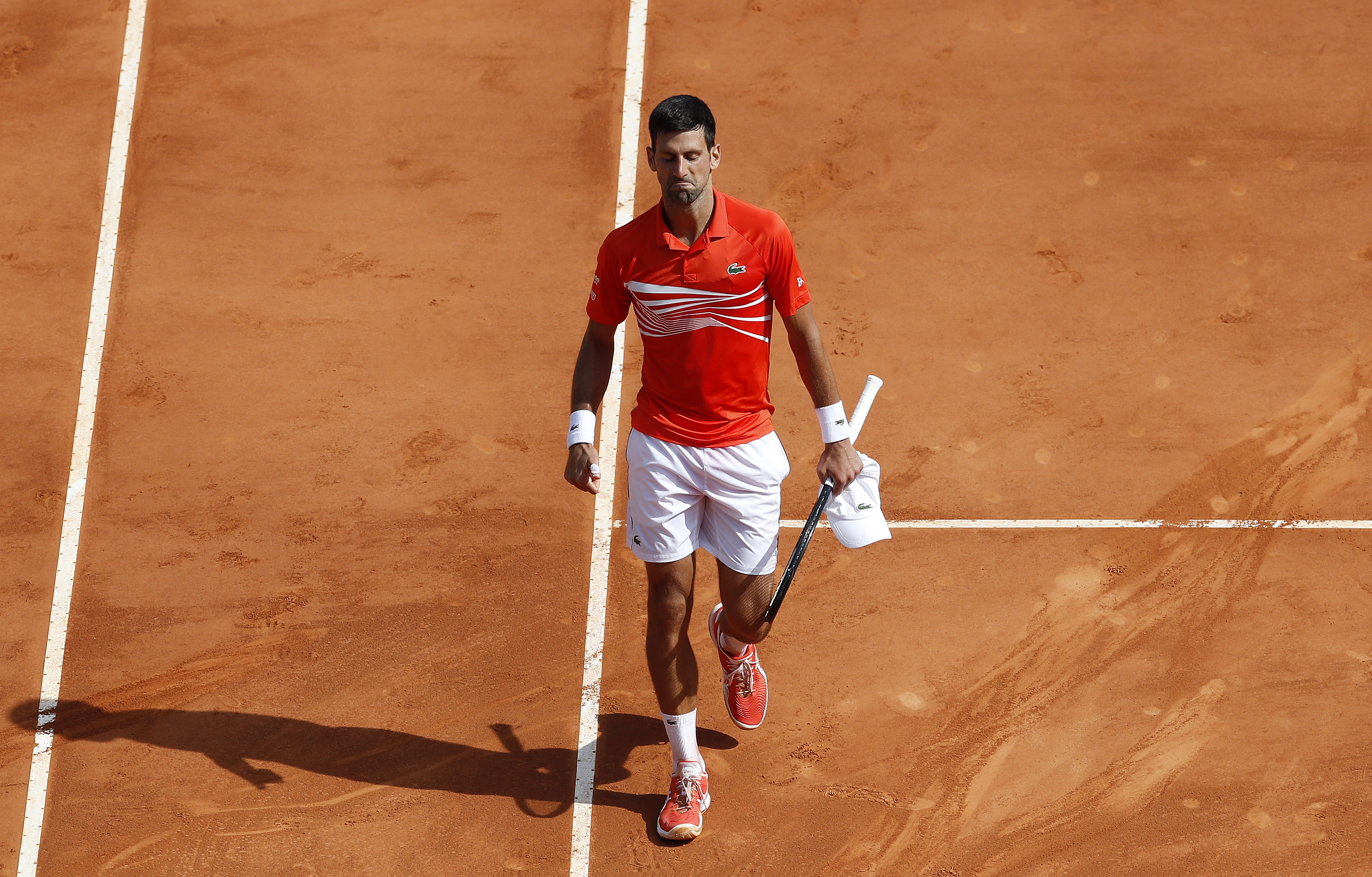 epa07515854 Novak Djokovic of Serbia reacts after losing his quarterfinal match against Daniil Medvedev of Russia at the Monte-Carlo Rolex Masters tournament in Roquebrune Cap Martin, France, 19 April 2019.  EPA-EFE/SEBASTIEN NOGIER