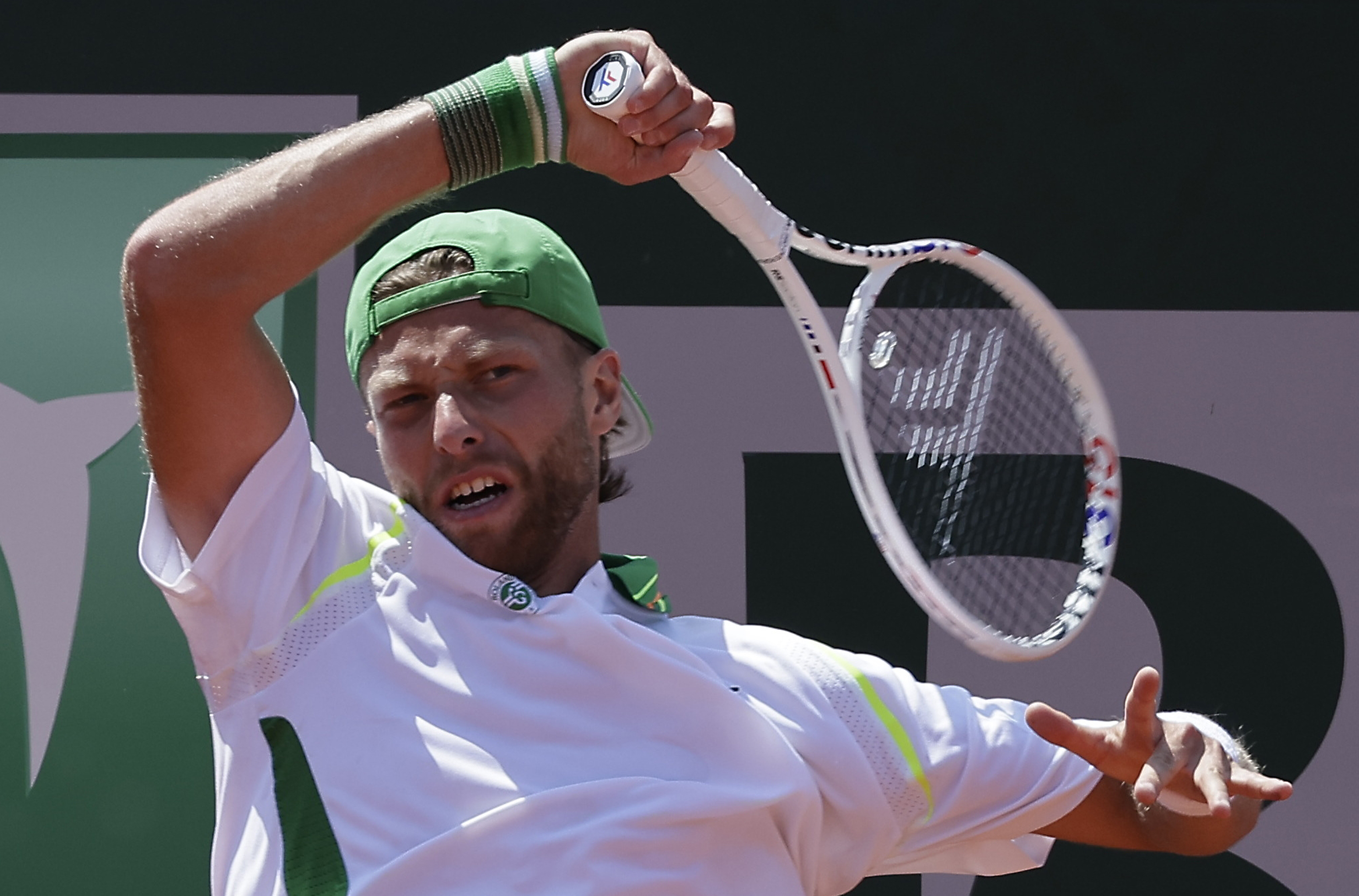 epa10659775 Hugo Grenier of France plays Marton Fucsovics of Hungary in their Men's Singles first round match during the French Open Grand Slam tennis tournament at Roland Garros in Paris, France, 28 May 2023.  EPA-EFE/CHRISTOPHE PETIT TESSON