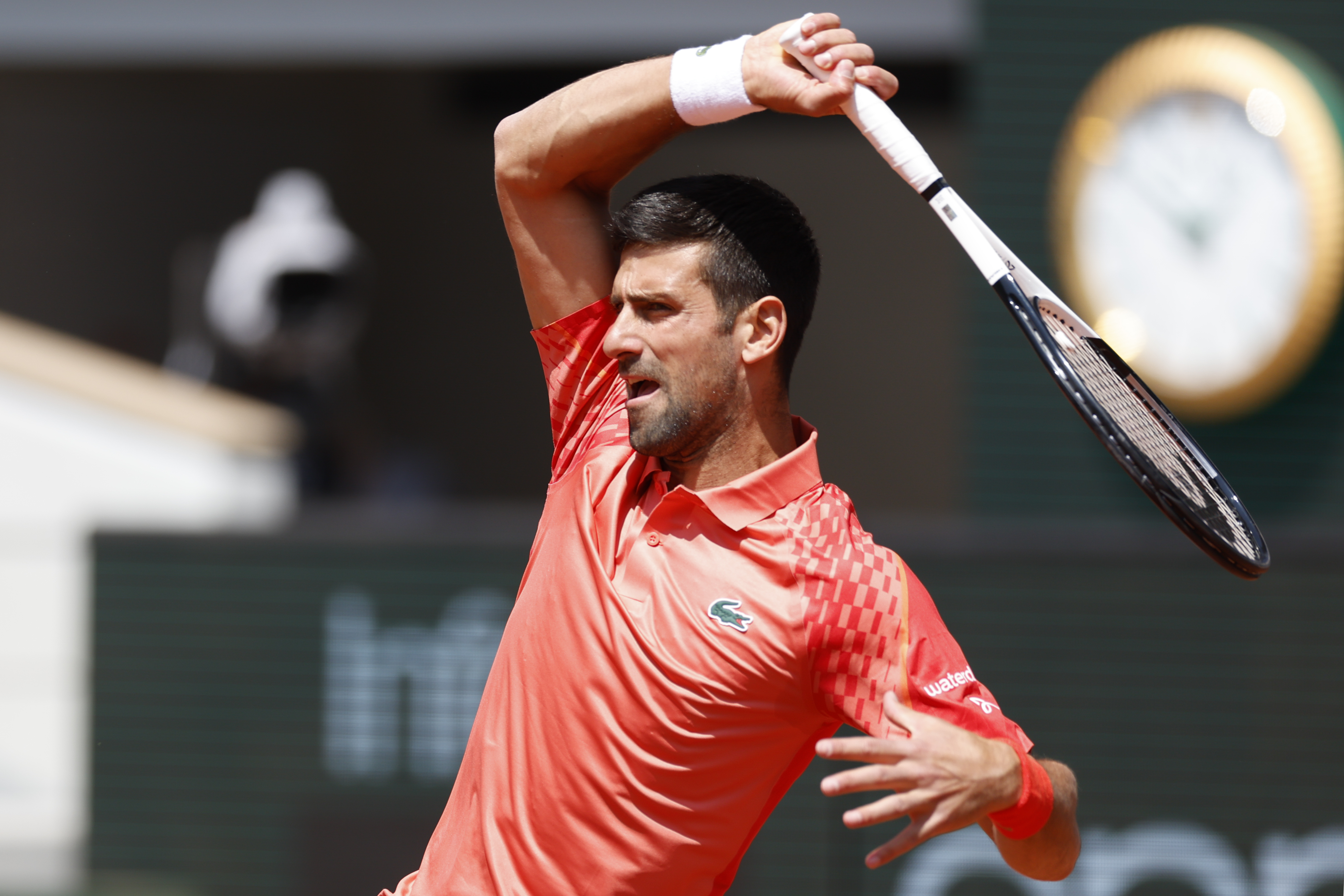 Serbia's Novak Djokovic plays a shot against Aleksandar Kovacevic of the U.S. during their first round match of the French Open tennis tournament at the Roland Garros stadium in Paris, Monday, May 29, 2023. (AP Photo/Jean-Francois Badias)