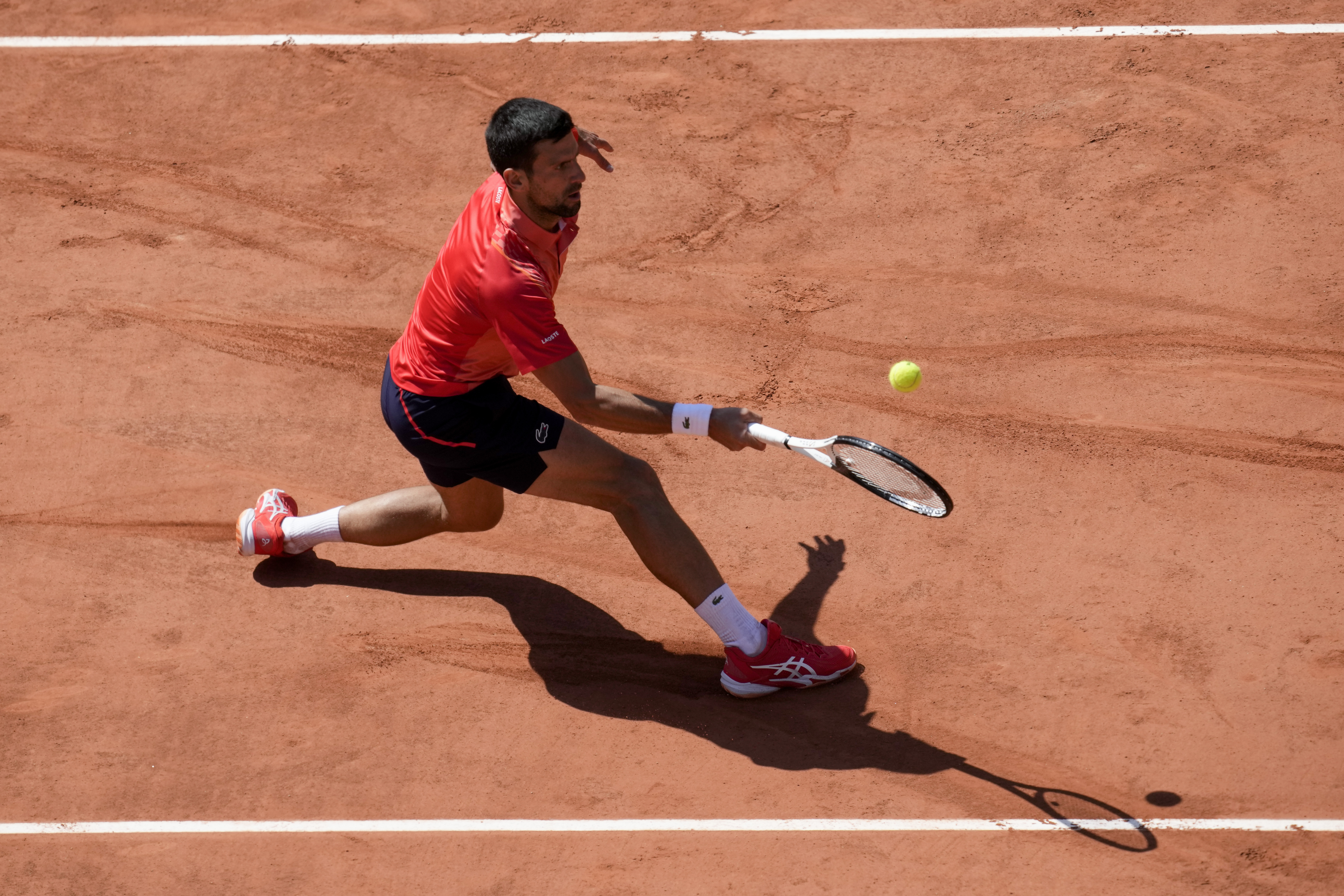 Serbia's Novak Djokovic plays a shot against Spain's Alejandro Davidovich Fokina during their third round match of the French Open tennis tournament at the Roland Garros stadium in Paris, Friday, June 2, 2023. (AP Photo/Christophe Ena)