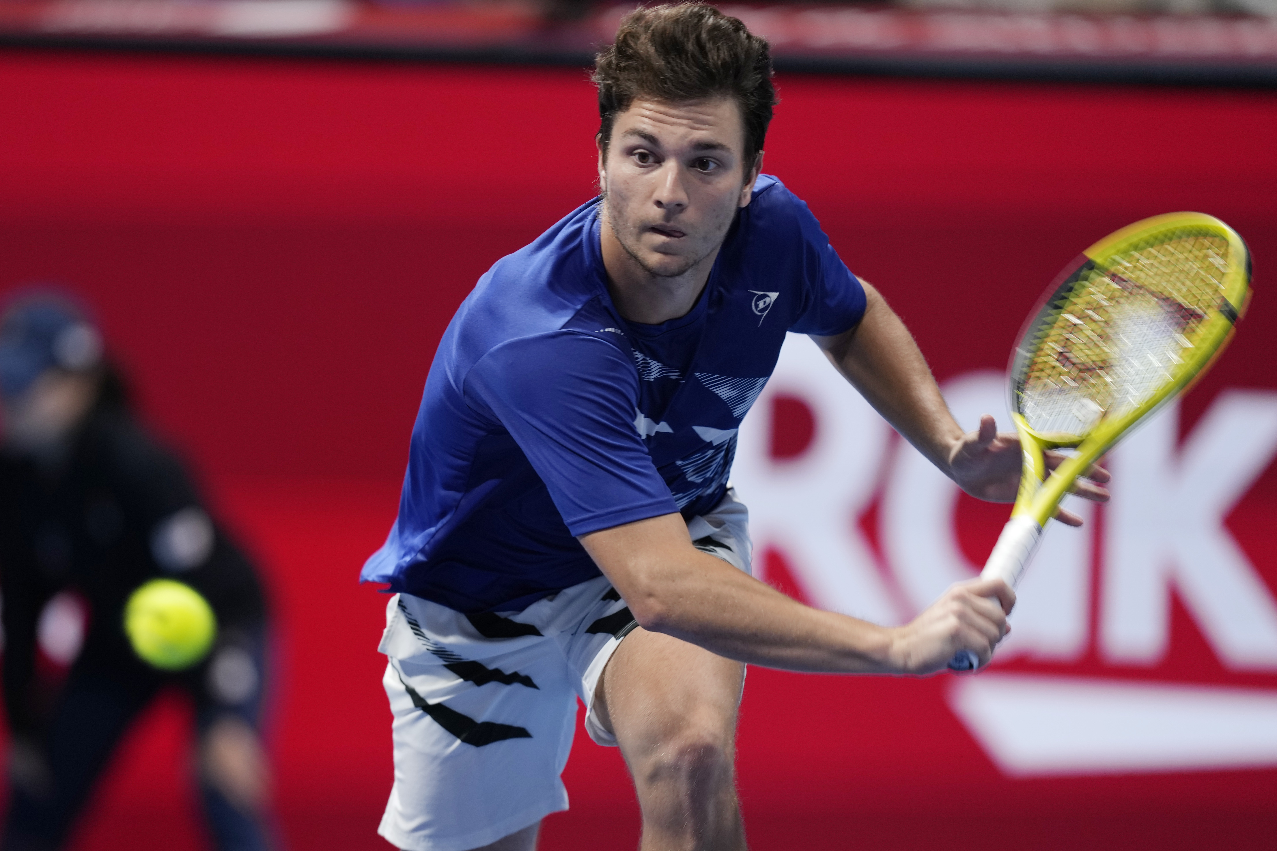 Miomir Kecmanovic of Serbia tries to return a shot against Frances Tiafoe of the U.S. in a quarterfinal of the Rakuten Open tennis tournament in Tokyo, Friday, Oct. 7, 2022. (AP Photo/Hiro Komae)
