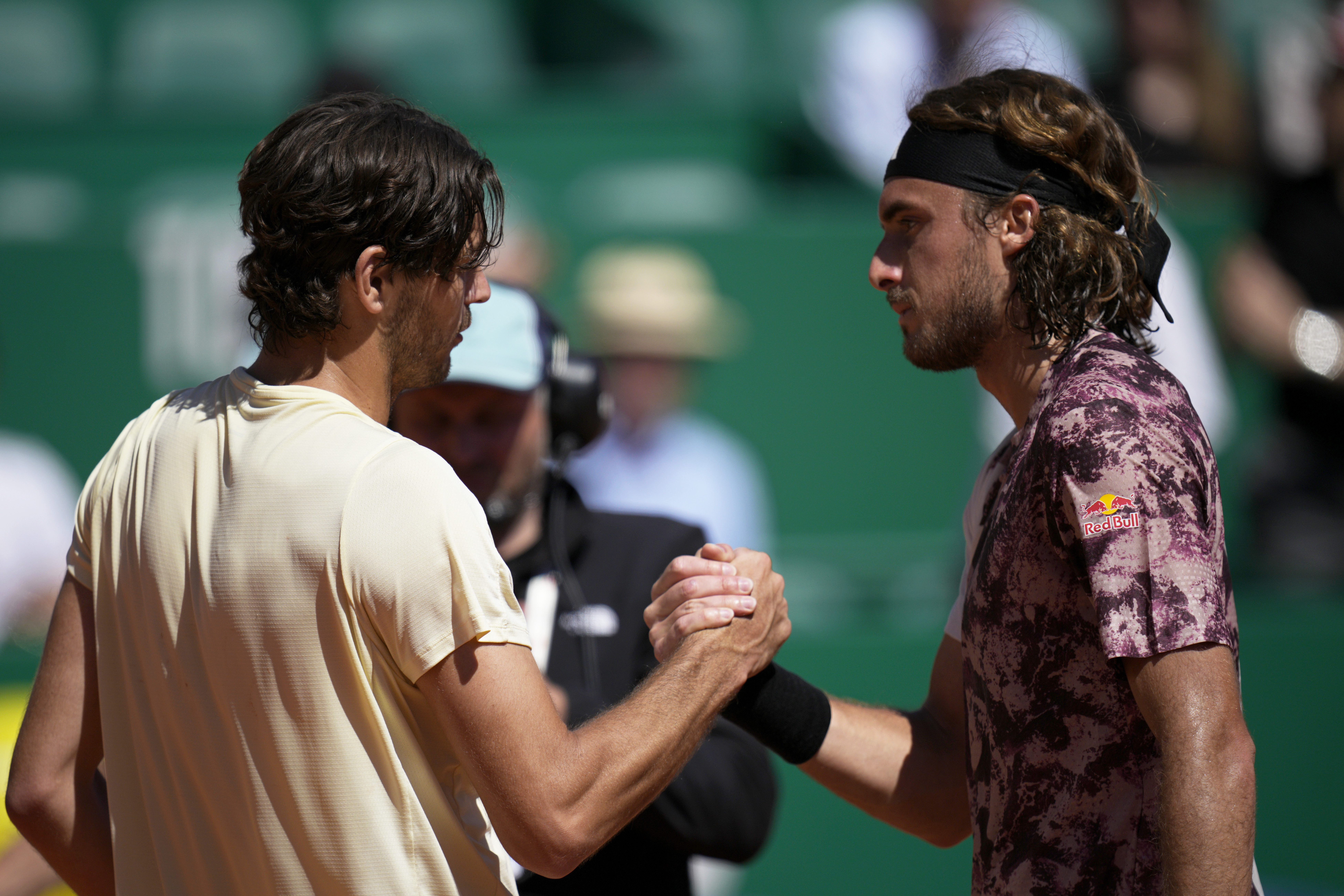 Taylor Fritz, of the United States, shakes hands with Stefanos Tsitsipas, of Greece, right, at the end of their Monte Carlo Tennis Masters quarterfinals match in Monaco, Friday, April 14, 2023. Fritz won 6/2, 6/4. (AP Photo/Daniel Cole)