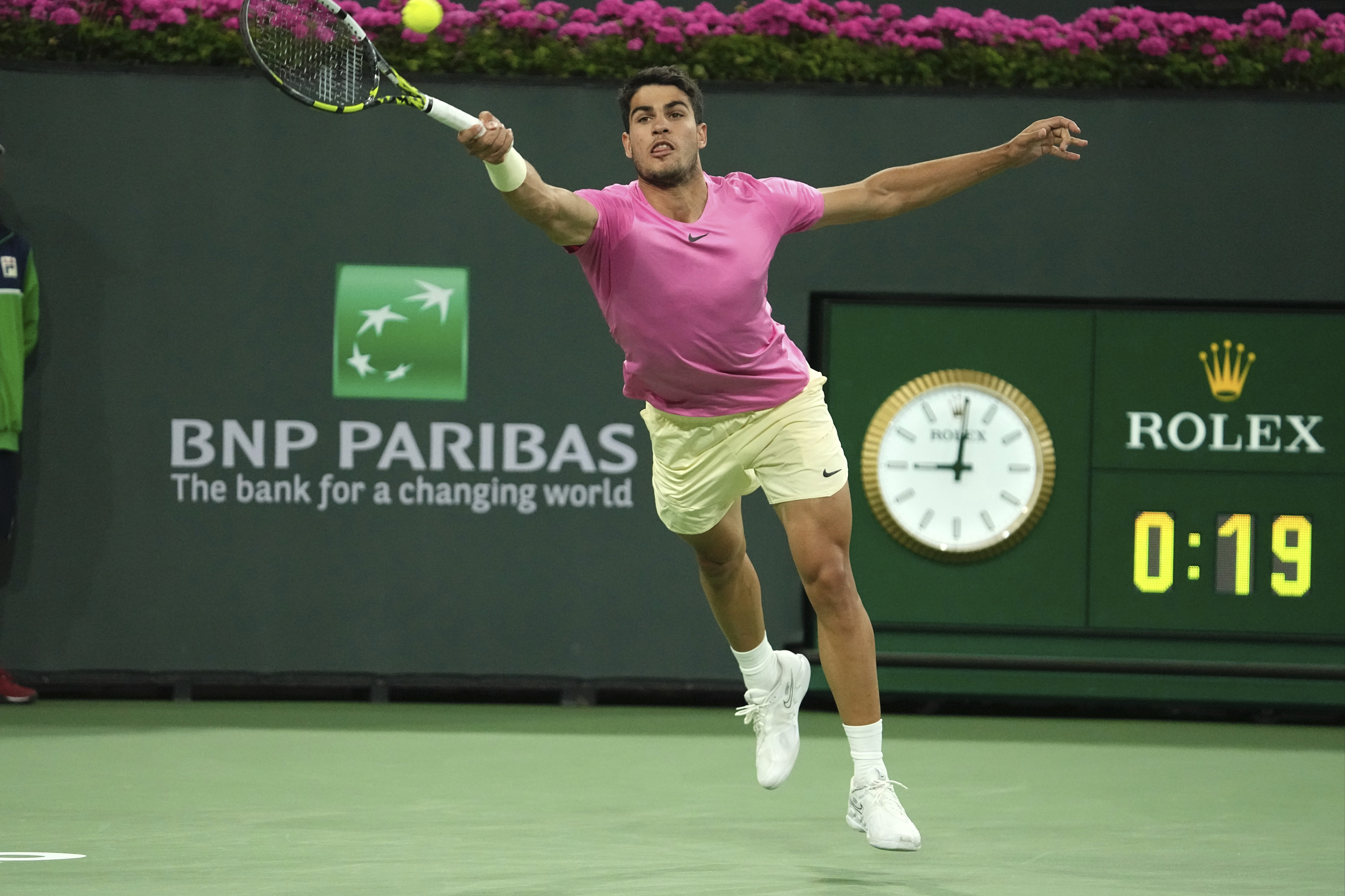 Carlos Alcaraz, of Spain, returns a shot to Tallon Griekspoor, of the Netherlands, at the BNP Paribas Open tennis tournament Monday, March 13, 2023, in Indian Wells, Calif. (AP Photo/Mark J. Terrill)