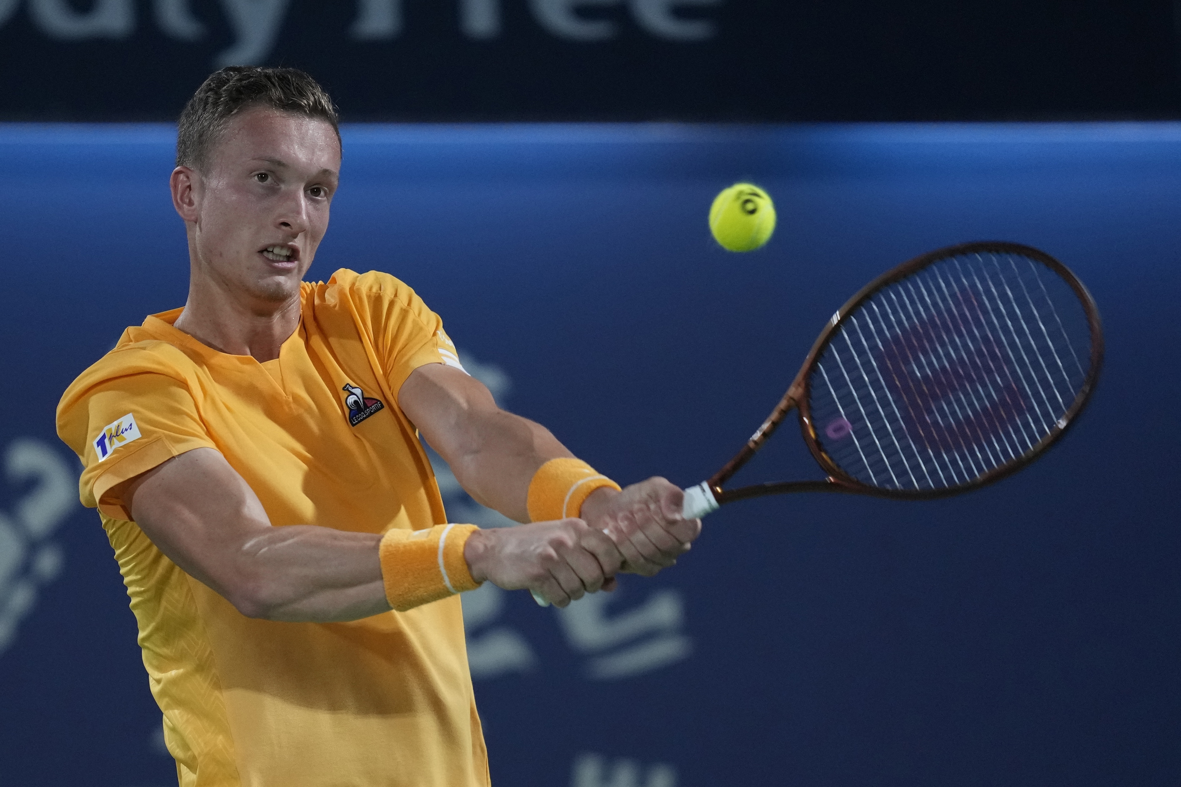 Czech's Jiri Lehecka returns the ball to Germany's Alexander Zverev during a match of the Dubai Duty Free Tennis Championships in Dubai, United Arab Emirates, Monday, Feb 27, 2023. (AP Photo/Kamran Jebreili)